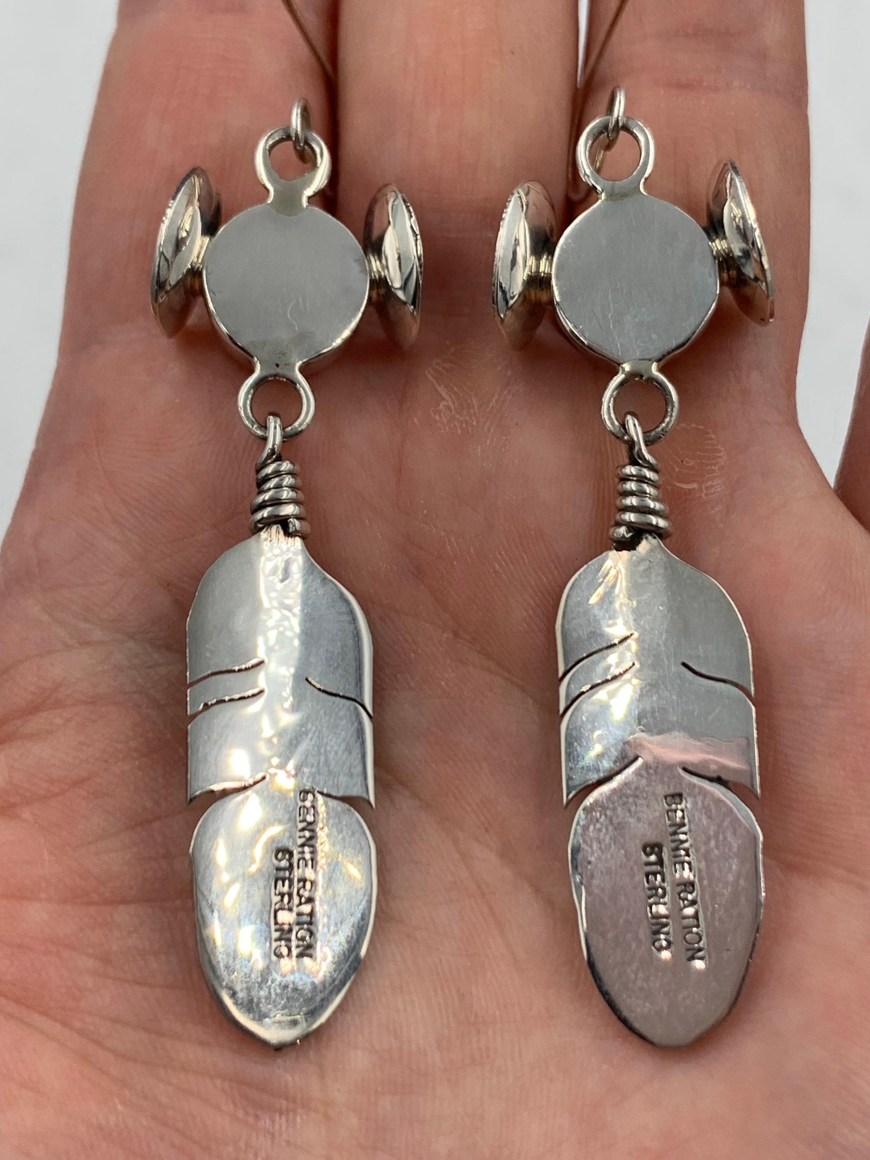 Sterling silver Hopi Maiden and Feather earrings by Navajo silversmith Bennie Ration. These beautiful earrings have a French wire back.

Earrings Measure:  2 1/4