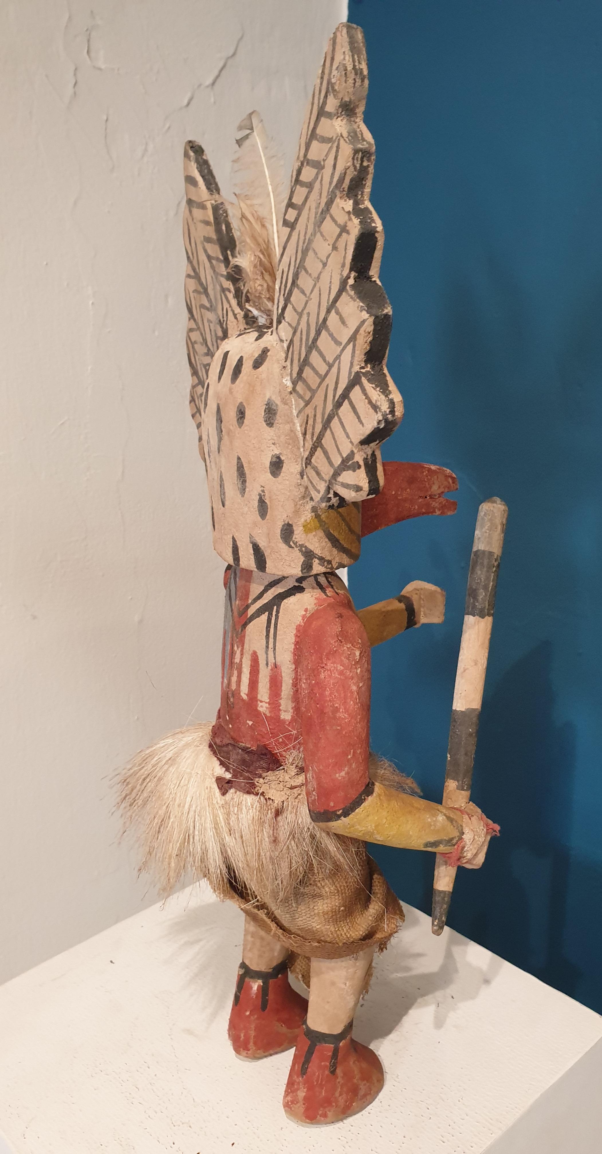 Native North American carved wood and painted effigy figure, Hopi/Navajo Katsina or Kachina doll. 

A particularly well detailed Katsina doll in good condition with feathers, fur-lined skirt, binding around the wrist to hold the wooden (talking?)