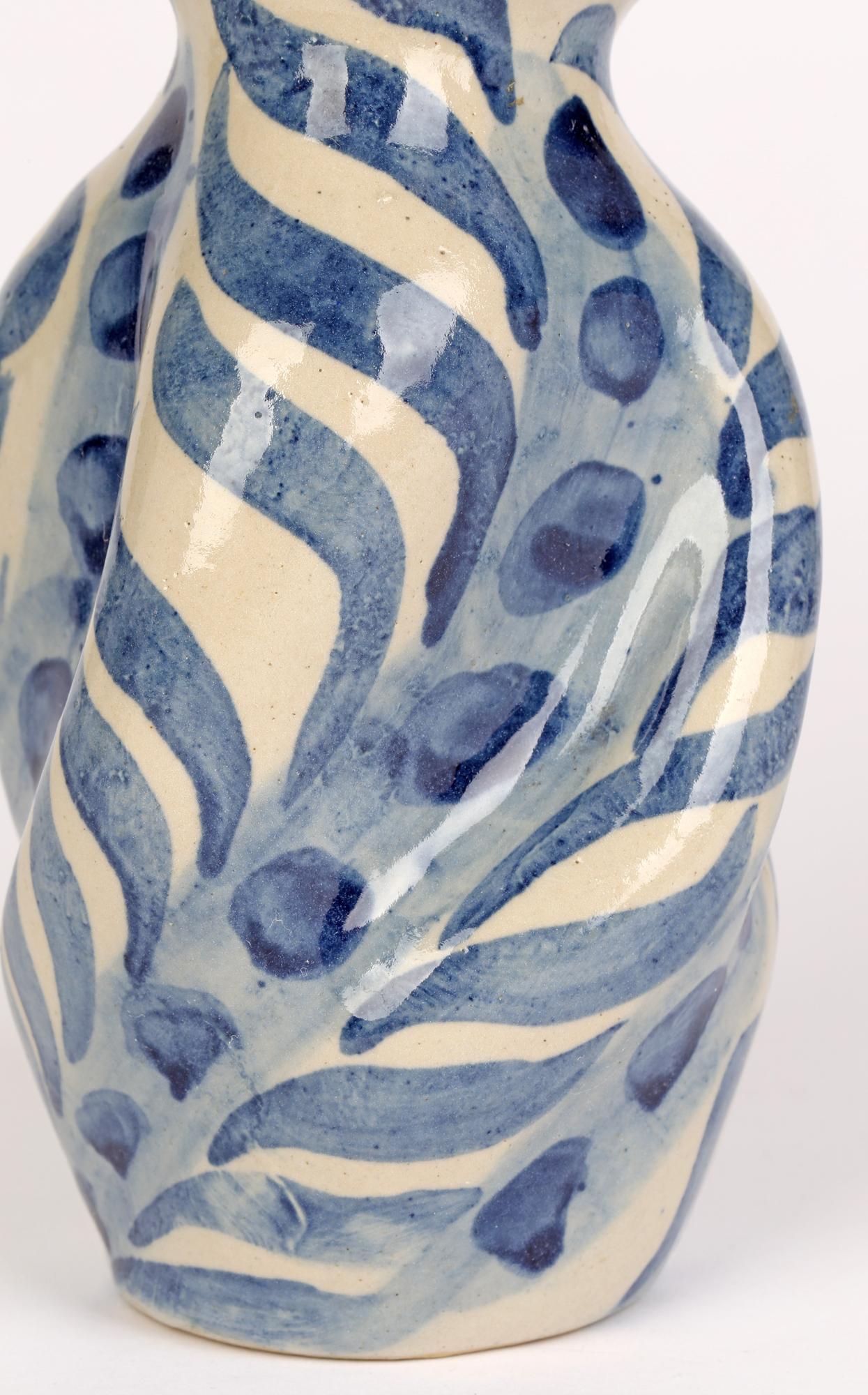 A very rare and stunning Arts & Crafts studio pottery vase of twisted floral shape made in London by Horace Elliott (British, 1851-1938) dating from the early 20th century. Horace Elliott has been referred to as ‘London’s Forgotten Potter’ however