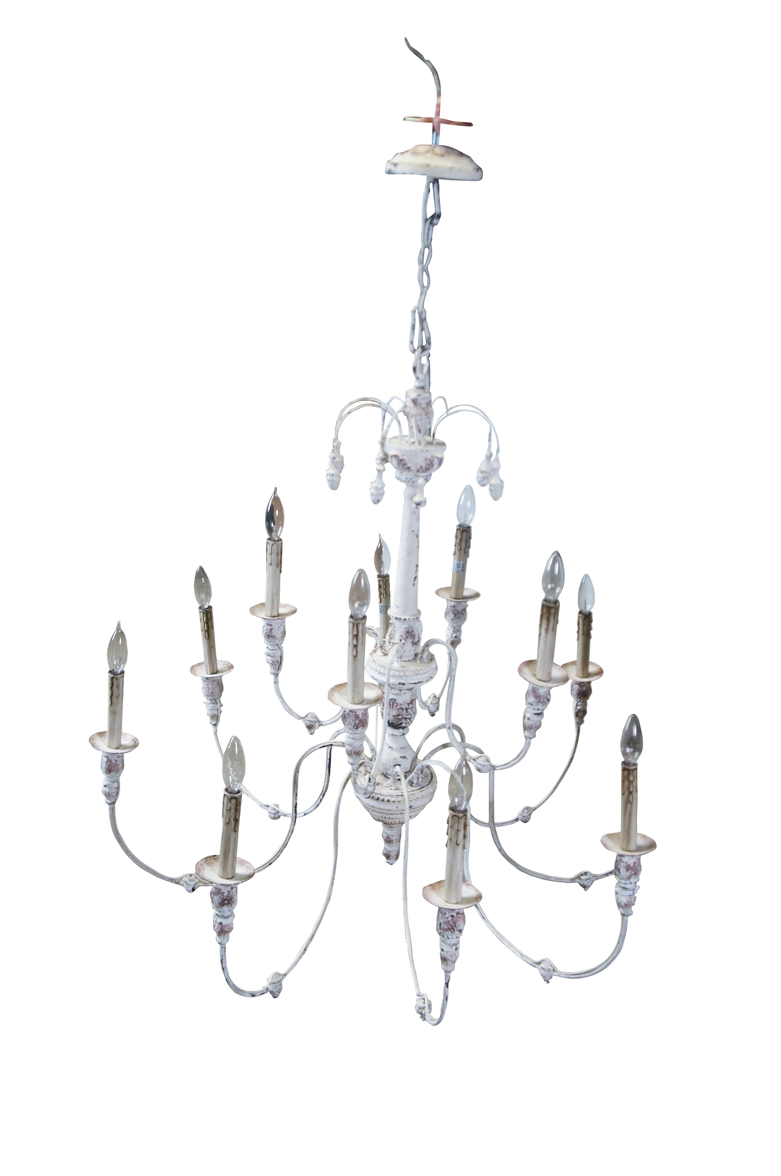 This Horchow Farmhouse two tier twelve arm Chandelier showcases a fine French Country styling and offers an elegant lighting addition to the dining room, living room, or foyer. Crafted with an off white painted acanthus accented central column, this