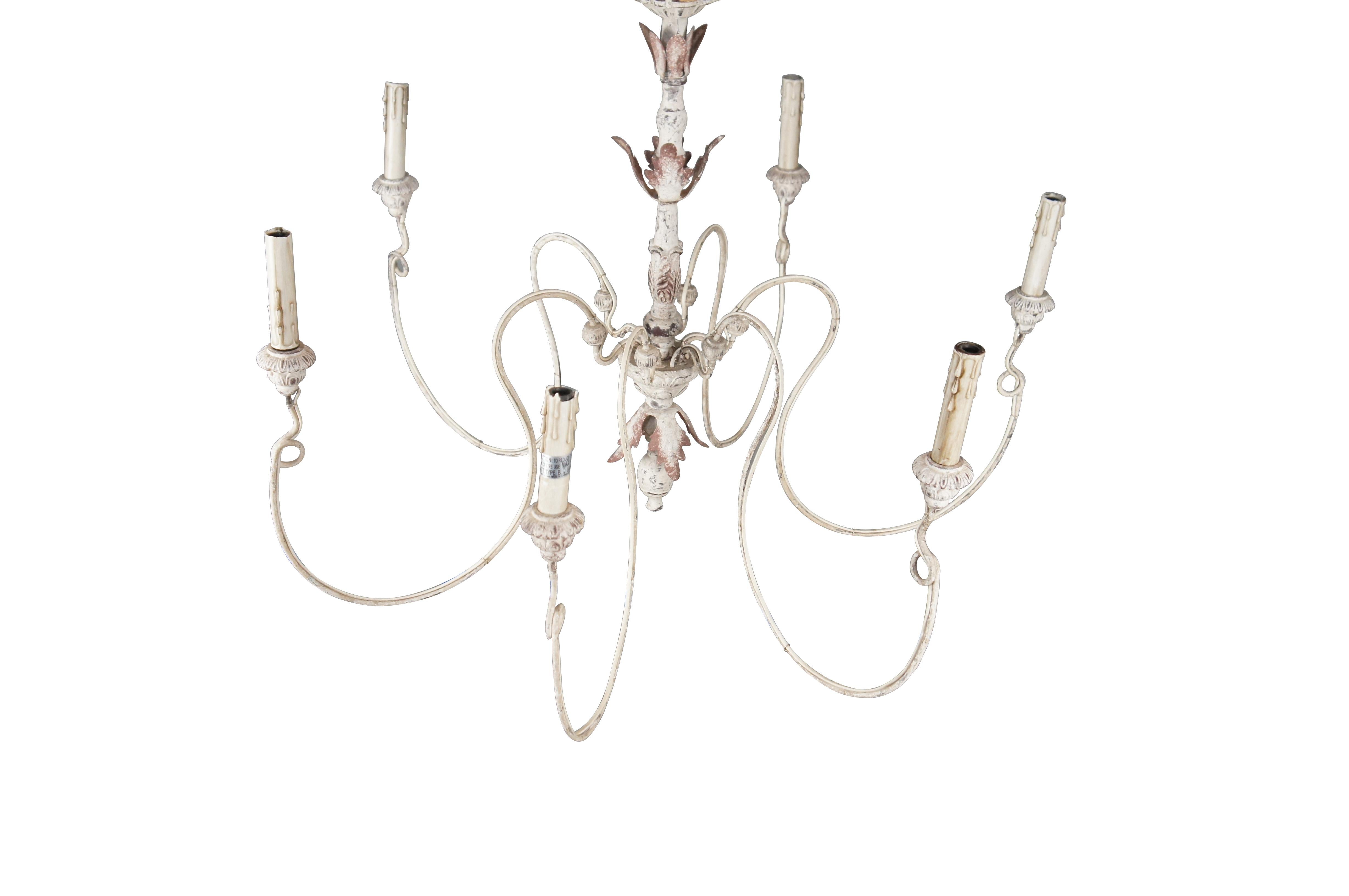 This Horchow Farmhouse Chandelier showcases a fine French Country styling and offers an elegant lighting addition to the dining room, living room, or foyer. Crafted with a painted, central wooden column, this decadent chandelier features curvaceous