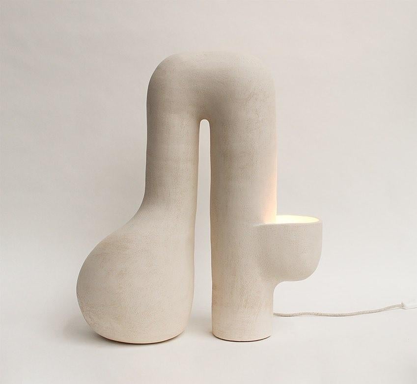 Horizon #5 stoneware lamp by Elisa Uberti
Unique
Limited series of 8 numbered copies + 1 AP
Dimensions: D 40 x W 20 x H 65 cm
Materials: white Stoneware
This product is handmade, dimensions may vary.

After fifteen years in fashion, Elisa