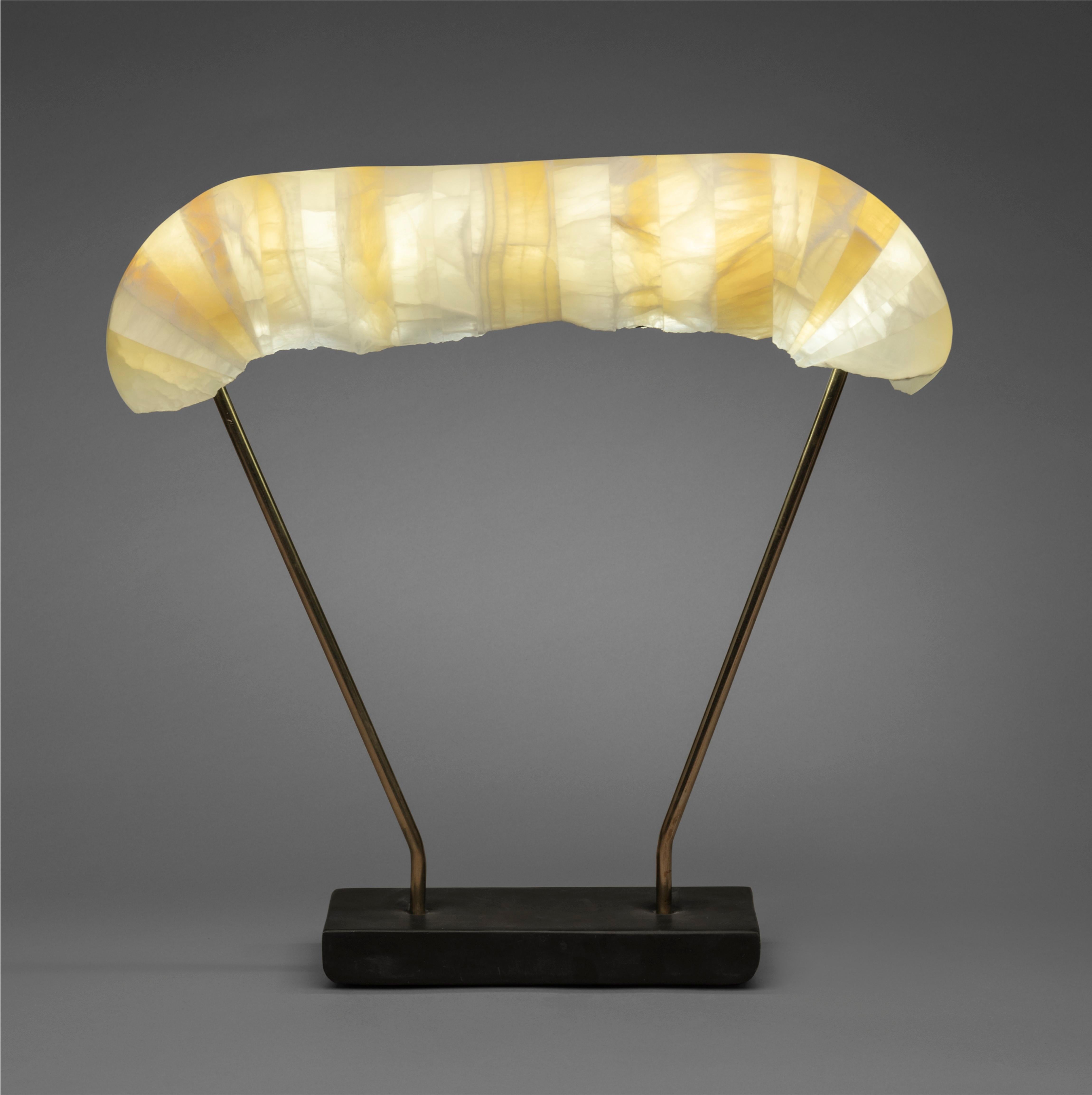Illuminated sculpture composed of laminated alabaster using an additive (laminated) rather than the more traditional subtractive process of carving from a single block of stone. Individual prefabricated pieces of alabaster are glued together using