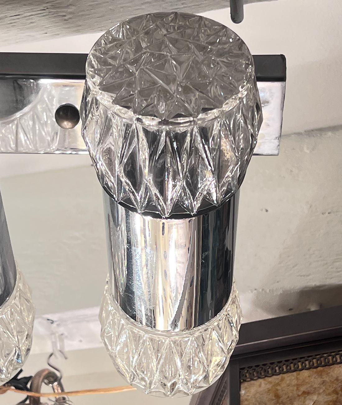 An Italian 1960's chrome-plated eight-light flush-mounted fixture with molded glass insets.

Measurements:
Height 7.5