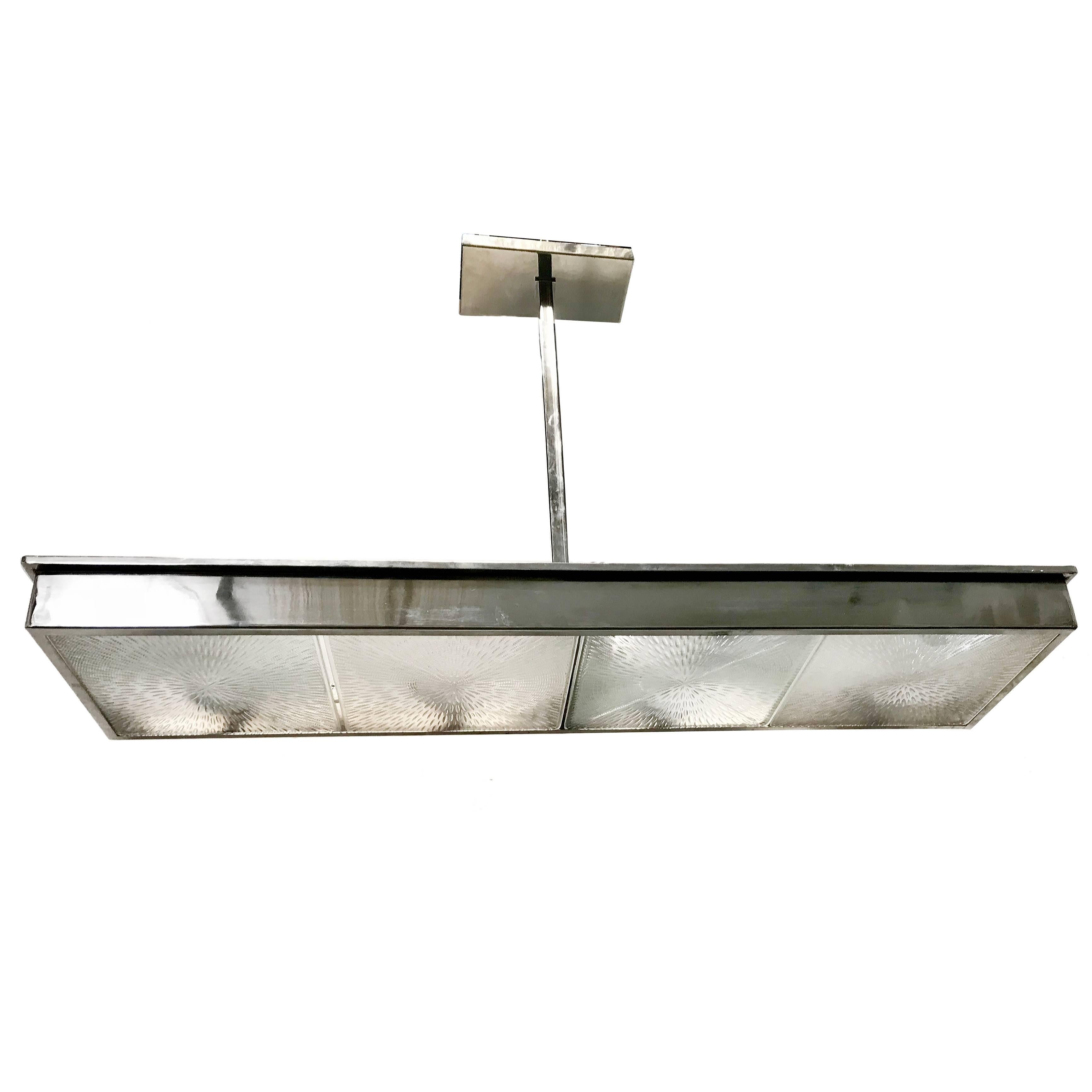 A circa 1960s French large horizontal nickel-plated light fixture with molded glass insets.

Measurements:
Drop: 41.25