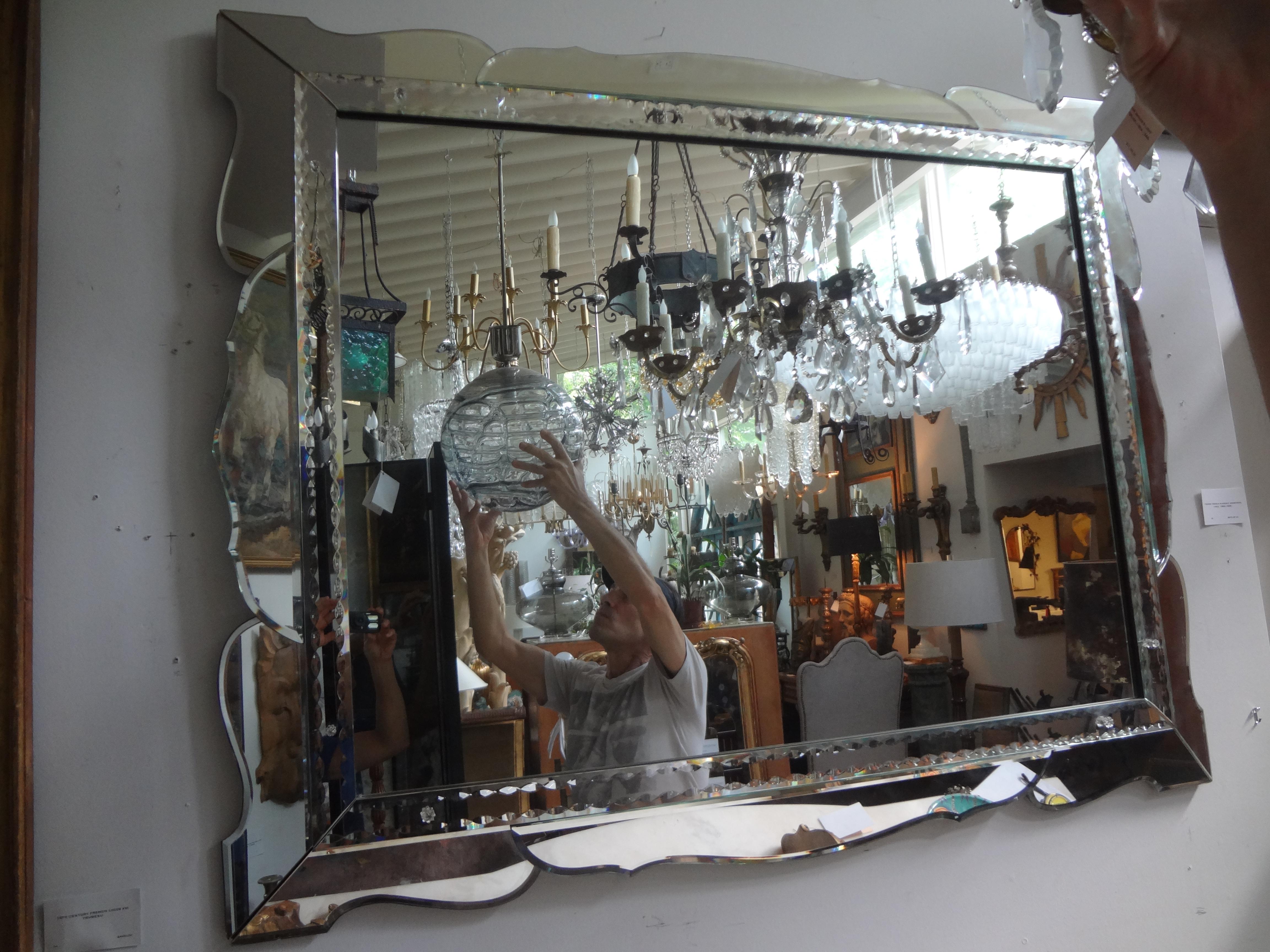 Huge stylish Italian Venetian horizontal beveled mirror. This fabulous totally beveled Hollywood Regency venetian mirror has a scalloped beveled perimeter with a large central mirror. Our uniquely shaped vVenetian mirror measures: 59.5