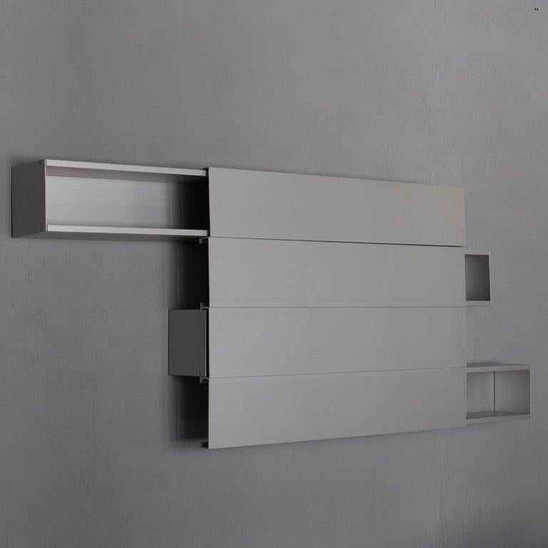 'Holizontals' shelves designed by Japanese designer Shigeru Uchida for Pastoe, inspired from Japanese traditional sliding doors. 
Aluminum.
Set of 4.