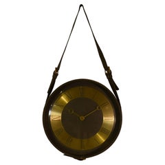 Orologio in pelle e lino di Jacques Adnet degli anni 50