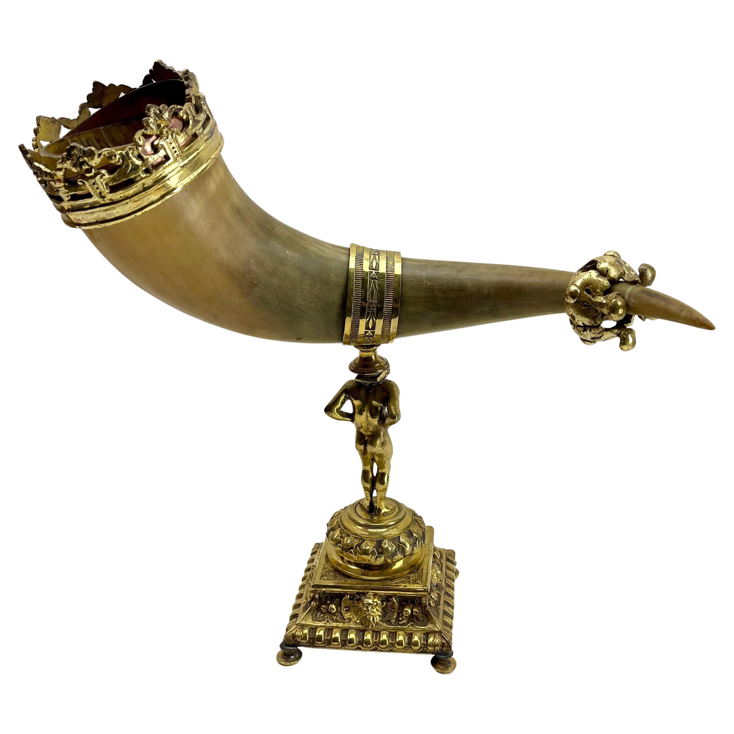 Horn and Gilt Bronze Ornaments on Stand Mounted Cornucopia.

Mounted, and  richly embellished with crown, collar
Supported on a cast stand on a square base.

Please don't hesitate to get in touch with any further questions.  

With Best Wishes