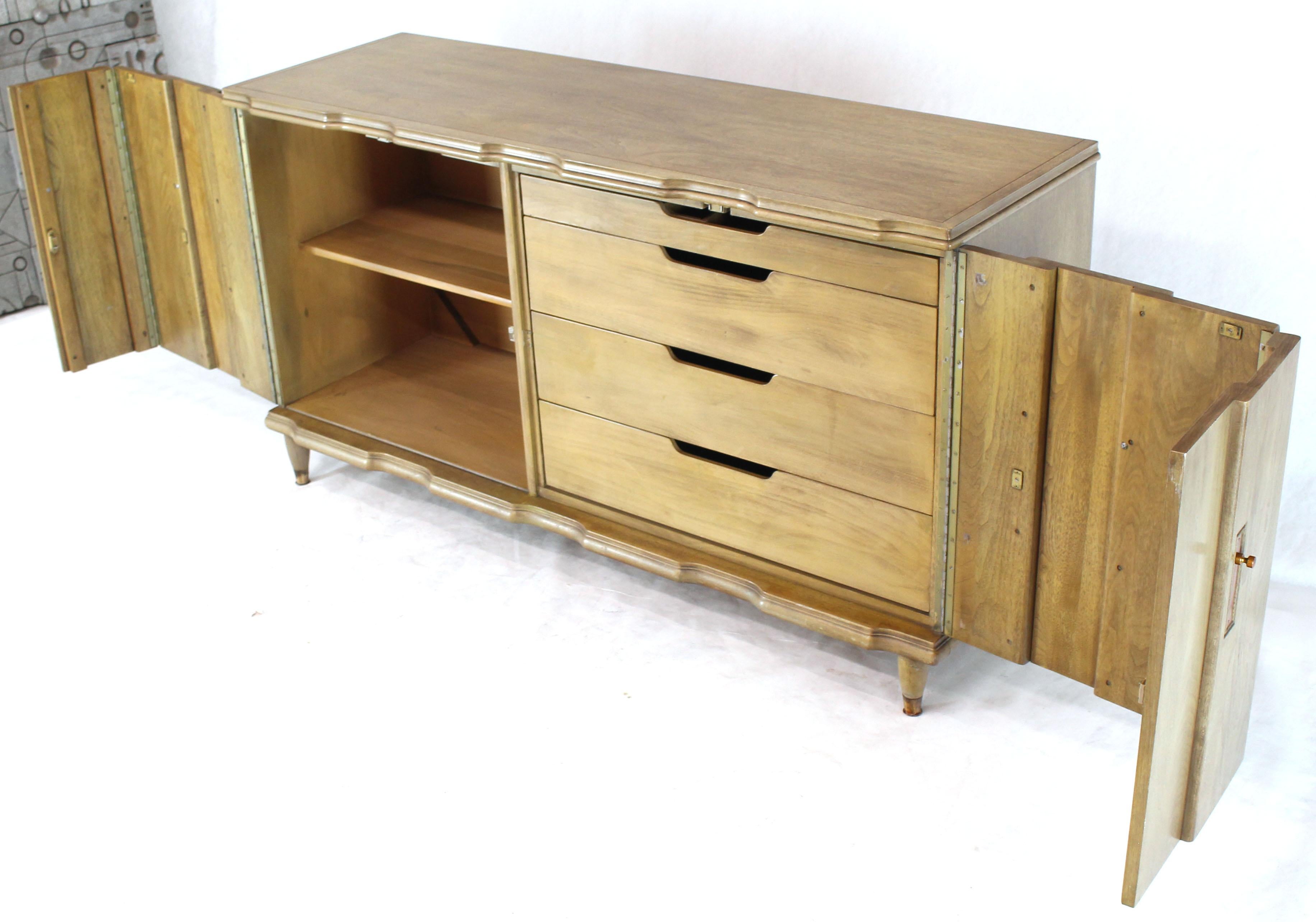 Mid-Century Modern folding double doors four drawers server credenza buffet cabinet. Horn tone finish with copper finished pulls.