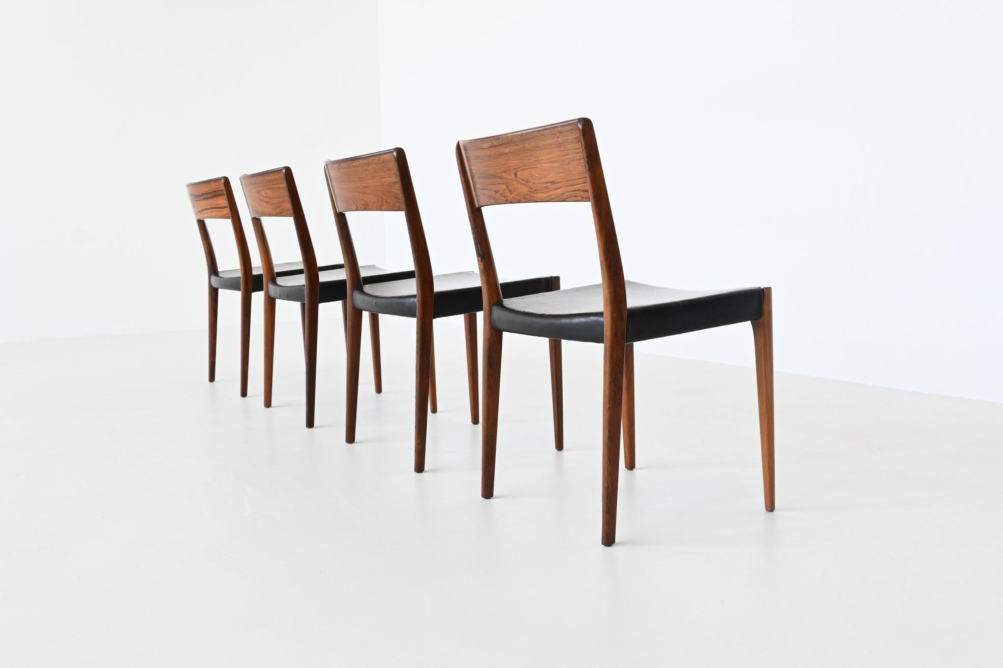 Beautiful shaped set of four dining chairs manufactured by Hornslet Mobelfabrik A/S, Denmark, 1960. These chairs are made of beautiful grained solid rosewood and are upholstered with original black leather. The wood of the chairs is professionally