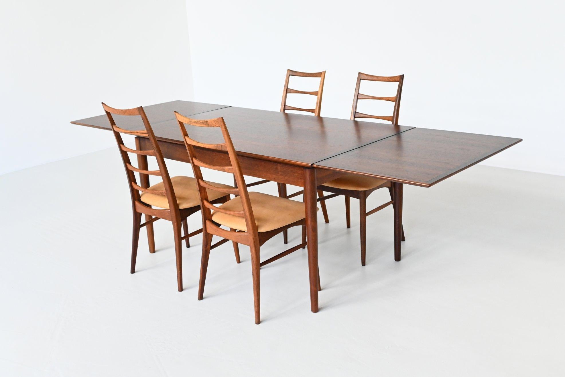 Beautiful crafted rosewood extendable dining table manufactured by Hornslet Mobelfabrik A/S, Denmark 1960. This table is made of rosewood and has an amazing grain to the warm rosewood veneer. It can be extended from 135 cm to 245 cm by pulling out