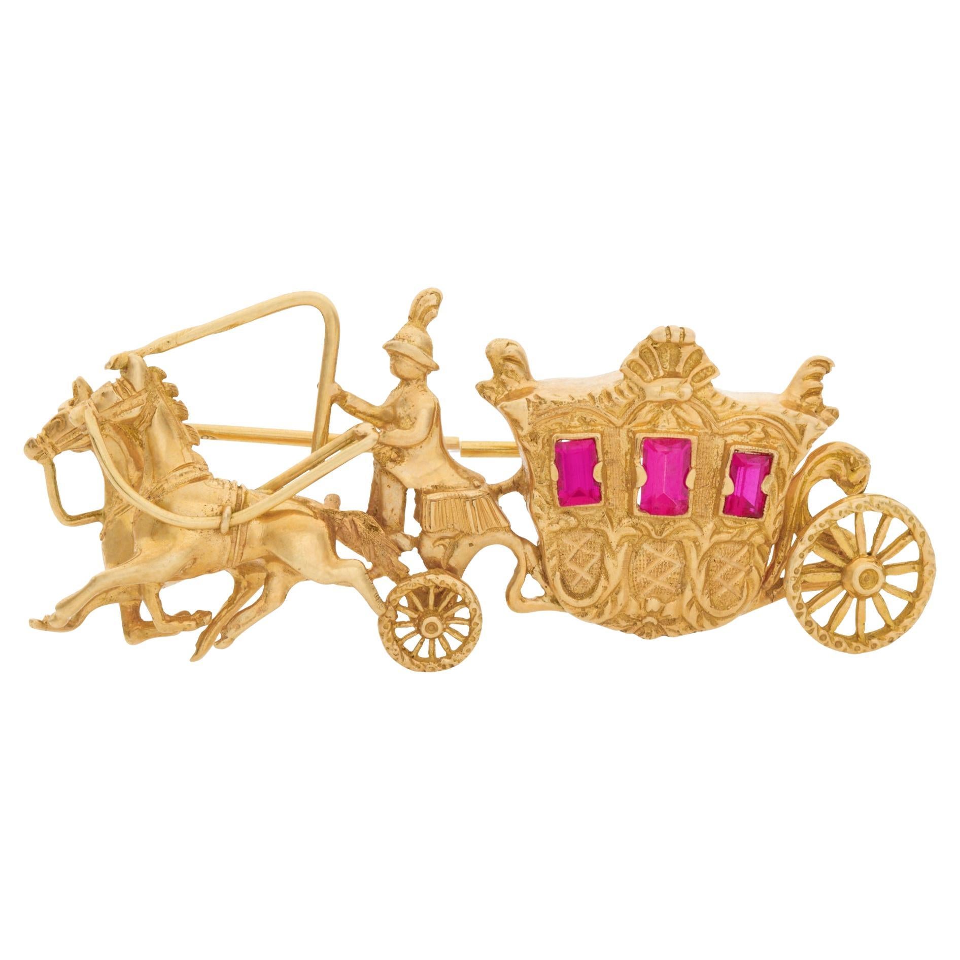 Horse and  carriage broach with rubies windows set in 18k yellow gold