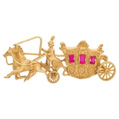 Vintage Horse and  carriage broach with rubies windows set in 18k yellow gold