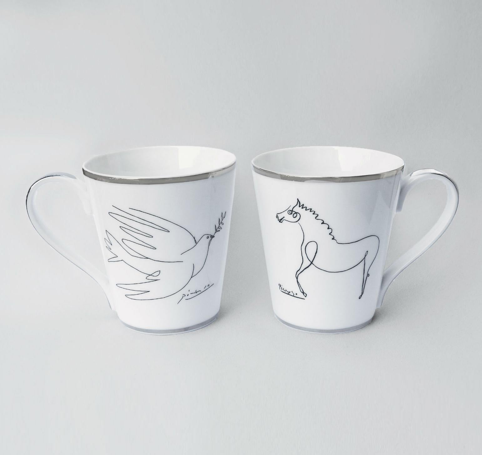 The Dove & The Horse Mug Set
Boxed set of coffee or tea mugs
Porcelain from Limoges with silver trim
Custom gift box

This boxed set of two porcelain coffee or tea mugs were made in collaboration with the artist's estate and feature two of