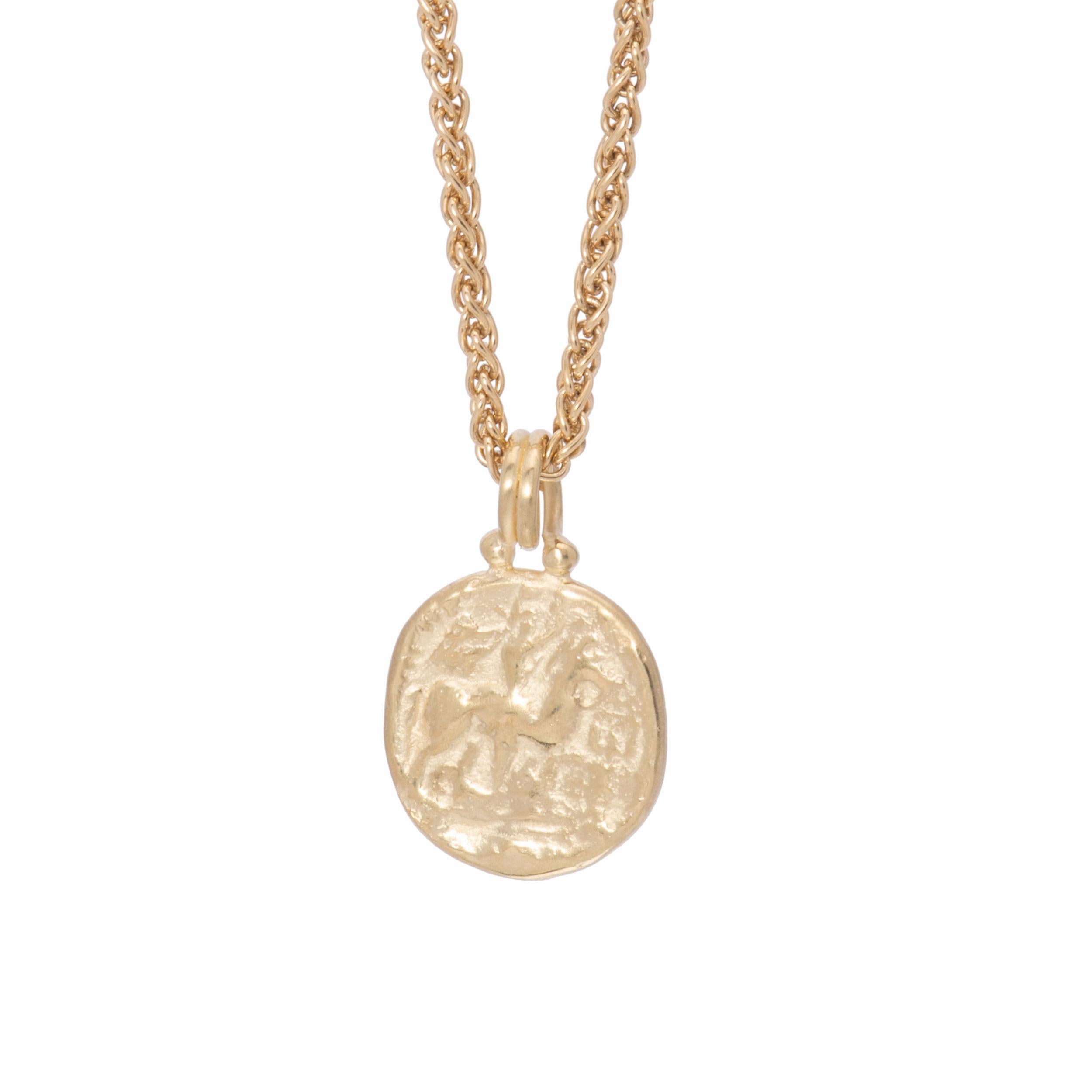 A classic equestrian profile of a horse and rider emerges from the background like an ancient coin. Indeed, the horse and rider pendant is a replica in 18k gold of an ancient coin, perhaps Greek or Persian in origin. Hand crafted in our studio of