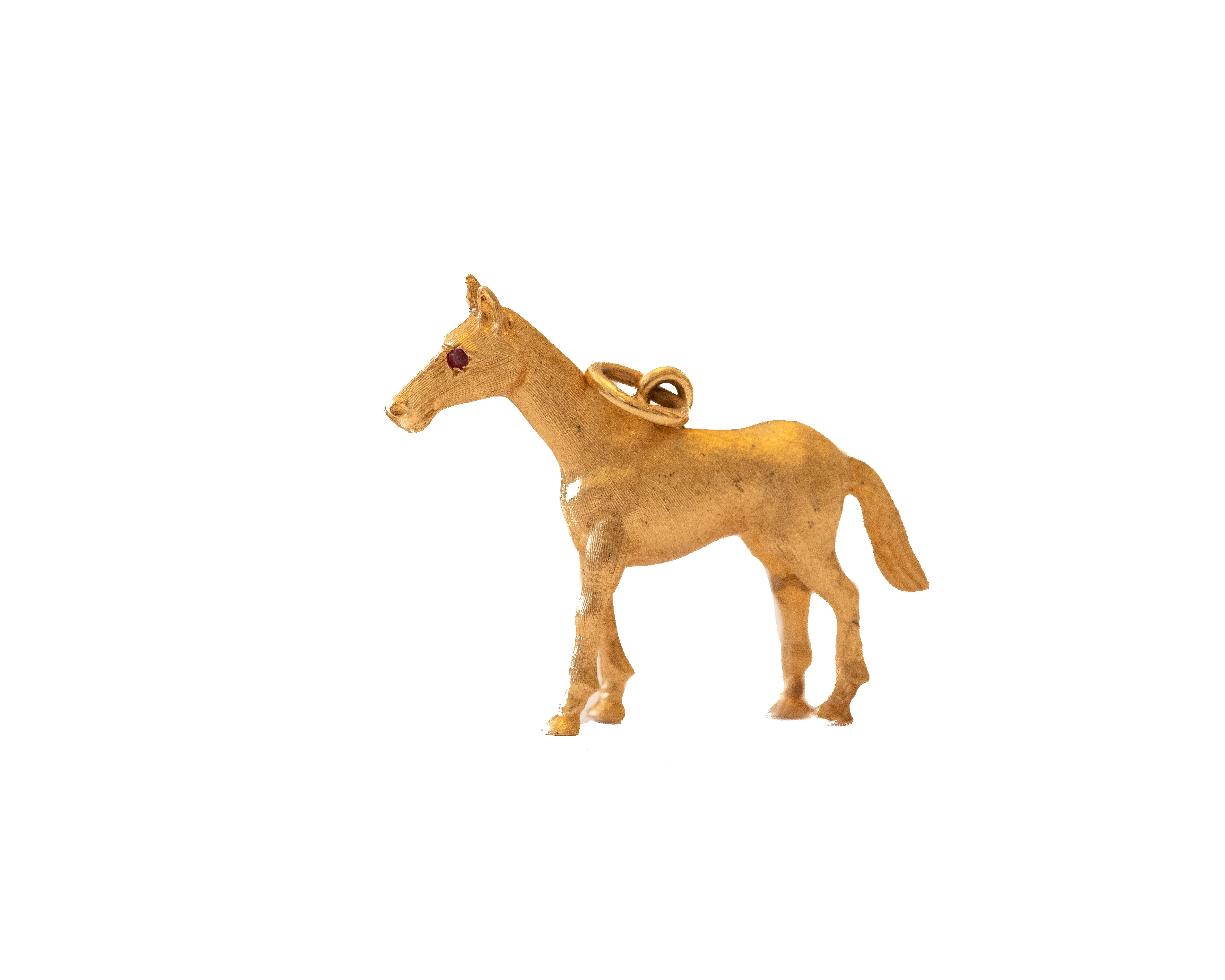 This cute 14K horse charm had a fun pop of color with the Ruby eyes. Perfect for the horse lover or charm collector in your life. 

Charm details:
Metal: 14 Karat Yellow Gold
Weight: 6.10 grams

Payment & Refund Details:
*More Pictures Available on