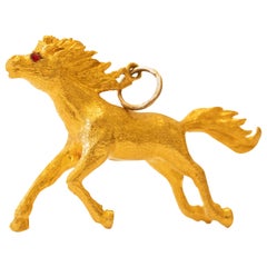 Horse Charm with Ruby Eyes in 24 Karat Yellow Gold