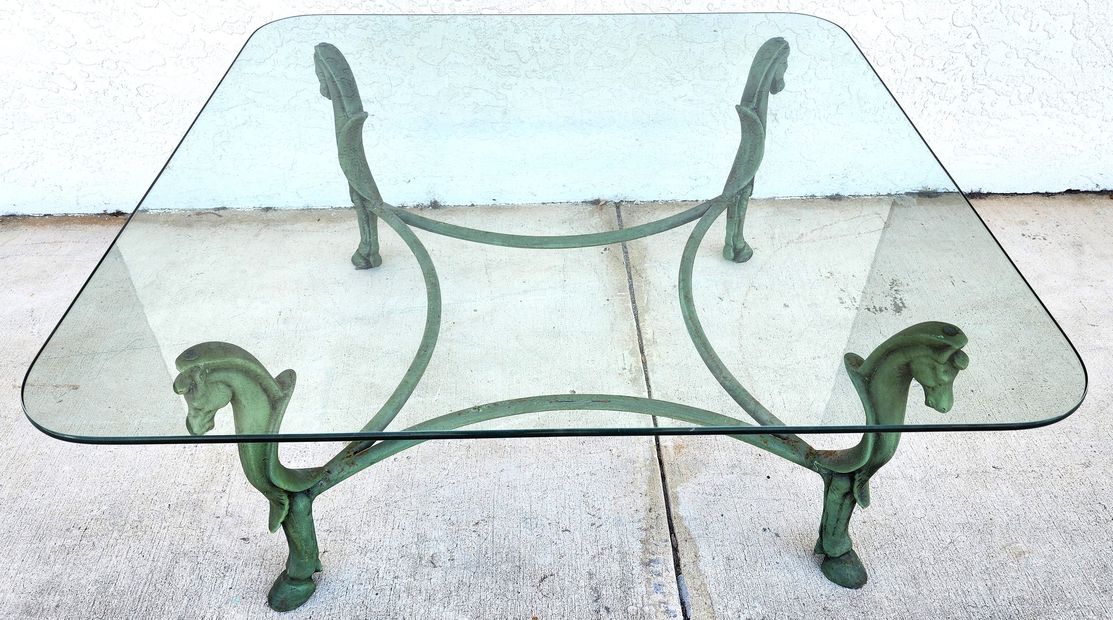For FULL item description click on CONTINUE READING at the bottom of this page.

Offering One Of Our Recent Palm Beach Estate Fine Furniture Acquisitions Of A
Vintage Patinated Iron Horse Head and Hoof Footed Coffee Table Patinated

We have many