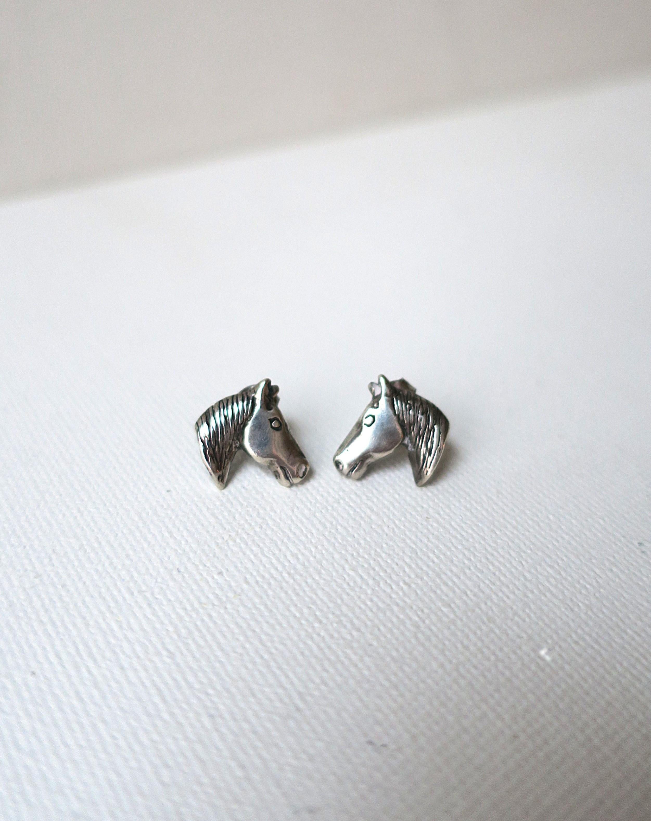 A pair of sterling silver Horse head equestrian style stud earrings. Marked '925' for sterling silver on bottom as shown in last image. Excellent condition. 


