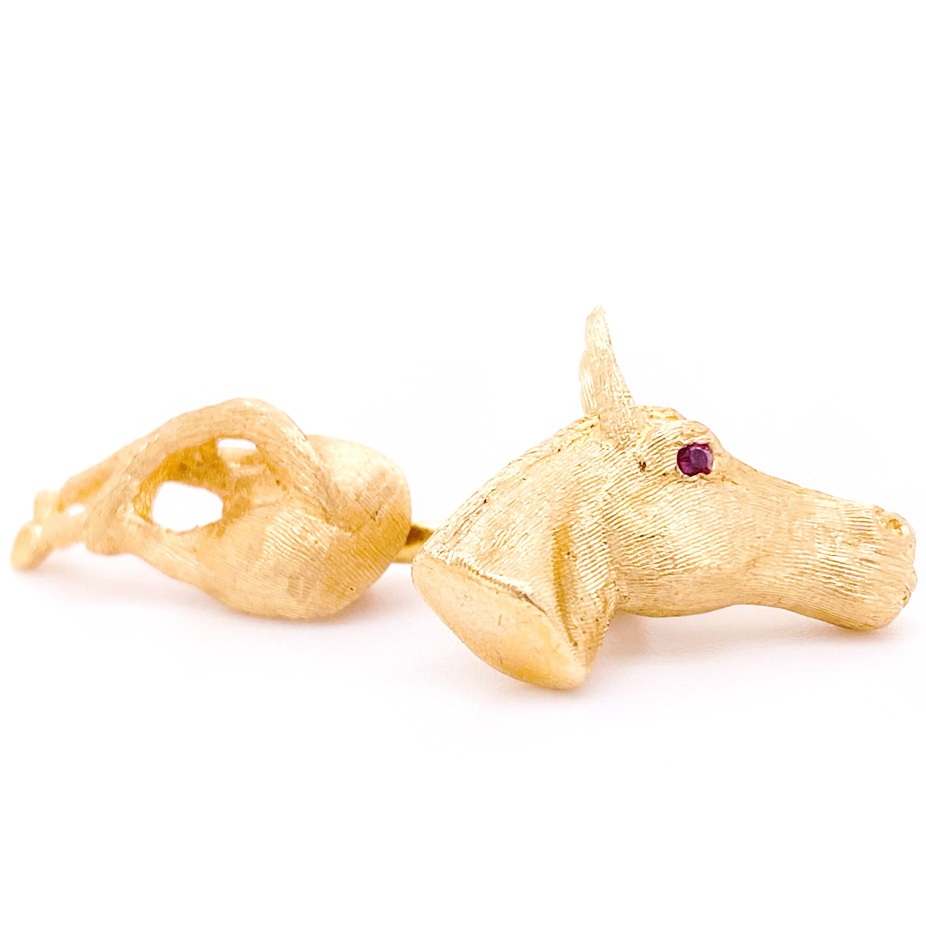 The lovely equestrian cufflinks  are solid 14 karat gold with gorgeous, bright red rubies in the eyes. These rich, 14 karat yellow gold, beautiful buttery color cufflinks are the perfect gift for your friend or family member that loves horses or can