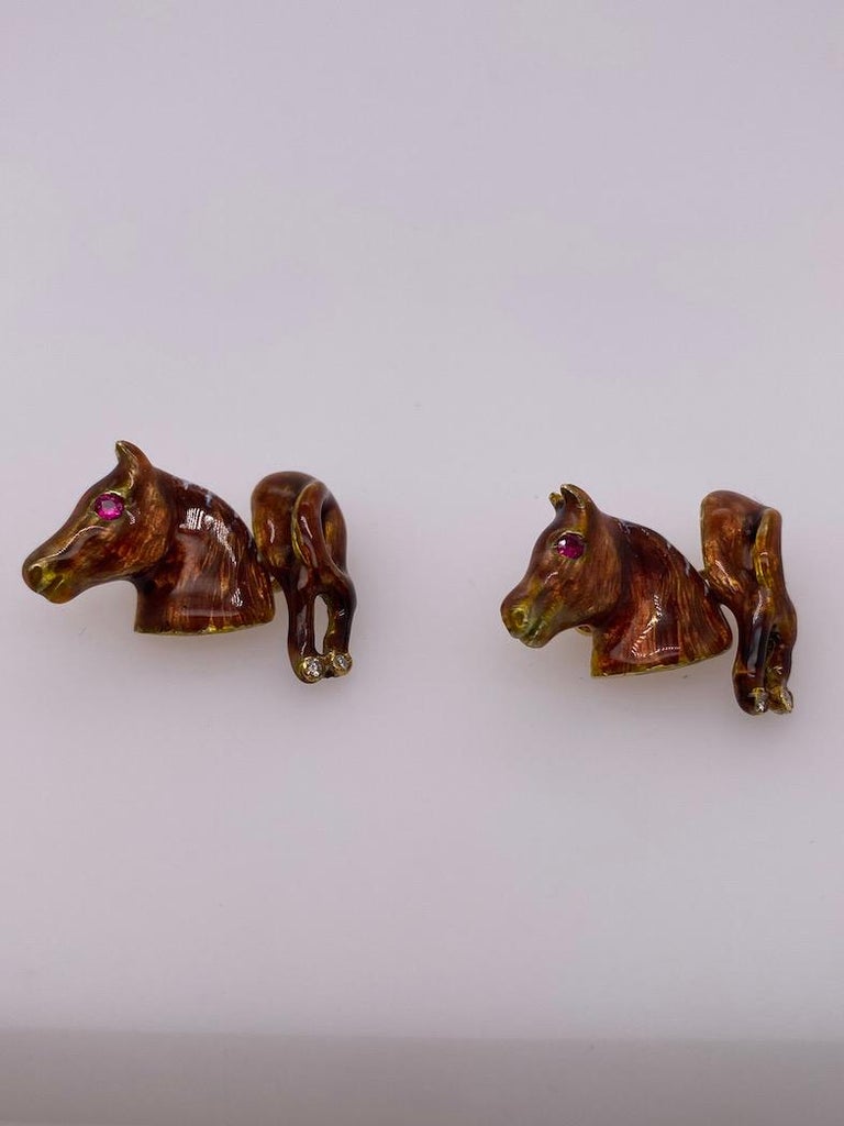Great enamel figural horse's head and rear cufflinks, in 14k yellow gold. Beautiful tawny color enamel, with faceted ruby eye and diamonds in the hooves.  A fun cufflink; shows up well on a cuff.

Alice Kwartler has sold the finest antique gold