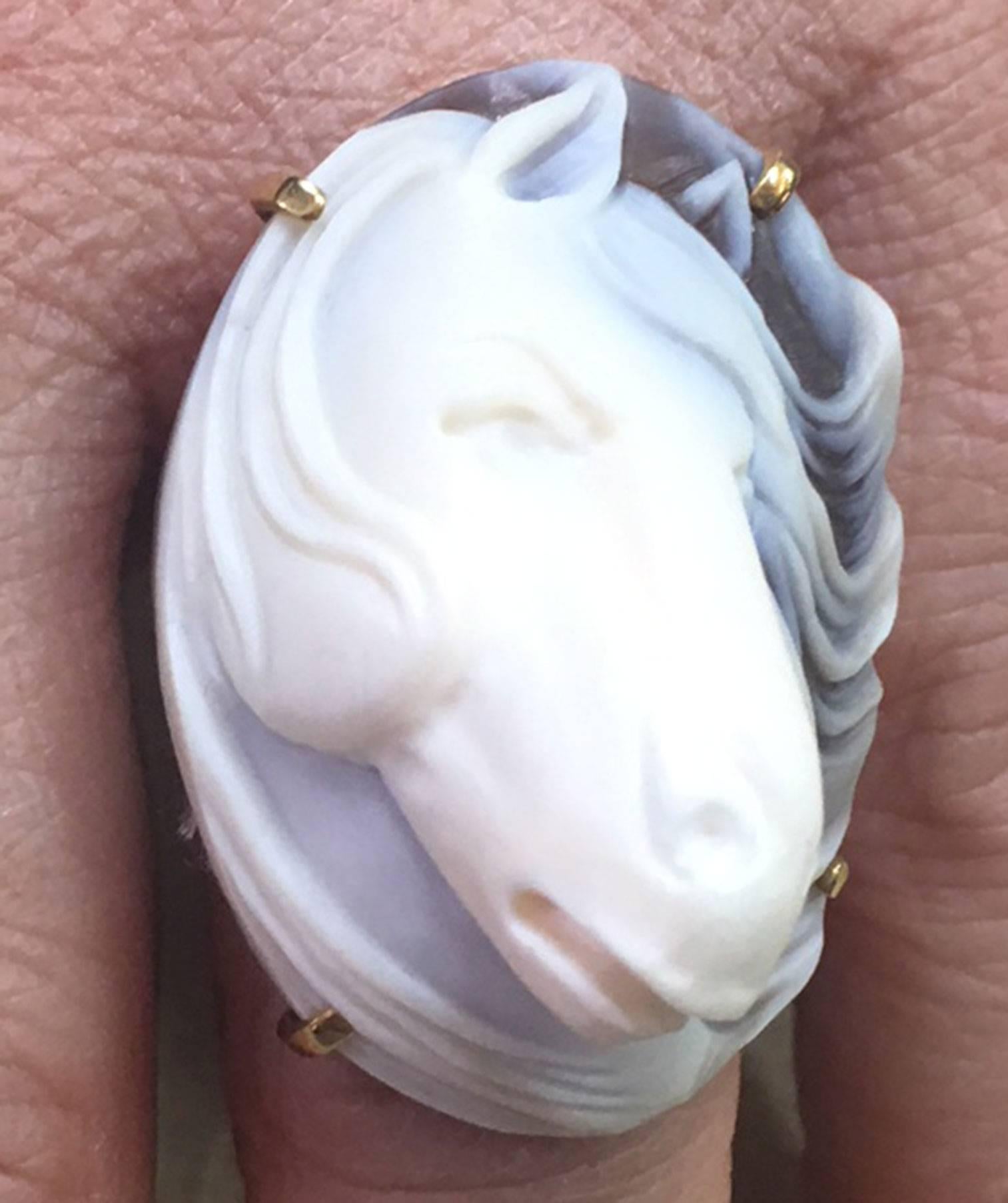 Beautiful highly detailed hand carved Heirloom Quality Cameo of a Horse Head adorns this ring. Hand crafted band on both sides so well designed and allows comfortable wear. Size 7.5; Rose Gold Sterling Silver mounting; shank marked: ITALY 925. Top