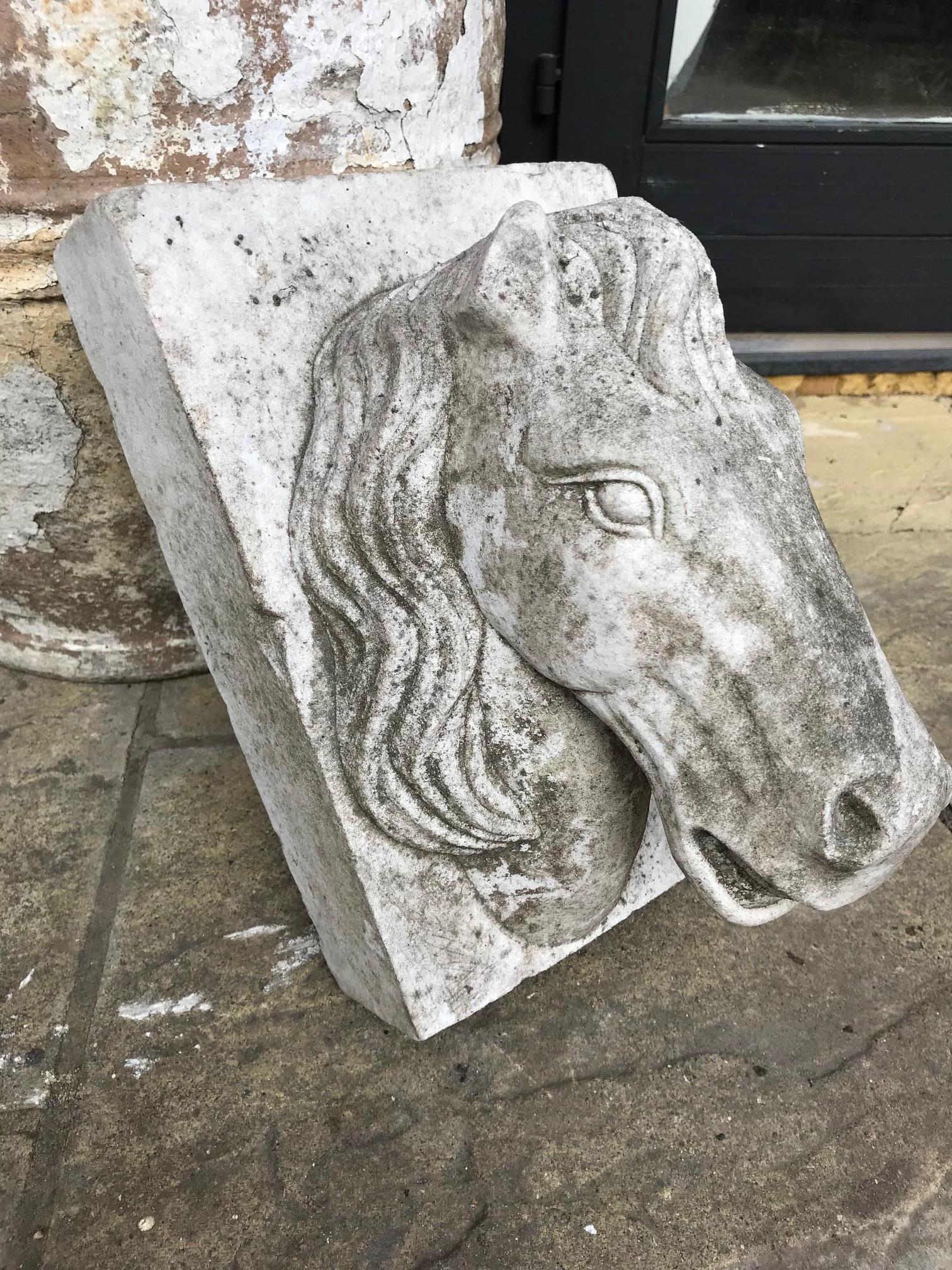 An elegant marble sculpture of a horse head used as a keystone most probably for an archway. French, early 20th century. Some damage to an ear and a visible signs of wear. One side of the horses head appears more weathered than the other half.
