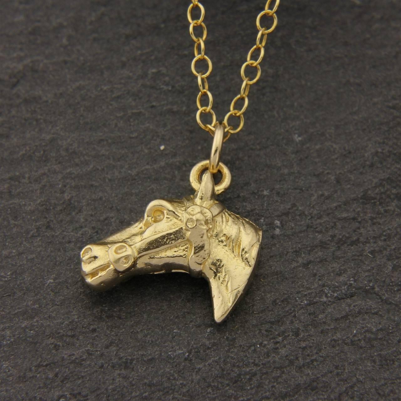 An artistic representation of the Horse head as a pendant, made from solid 9 Carat Gold with its 18 inches chain included.
This beautifully detailed, realistic design is handmade in Surrey by Simon Kemp, who is a third generation British jeweller.