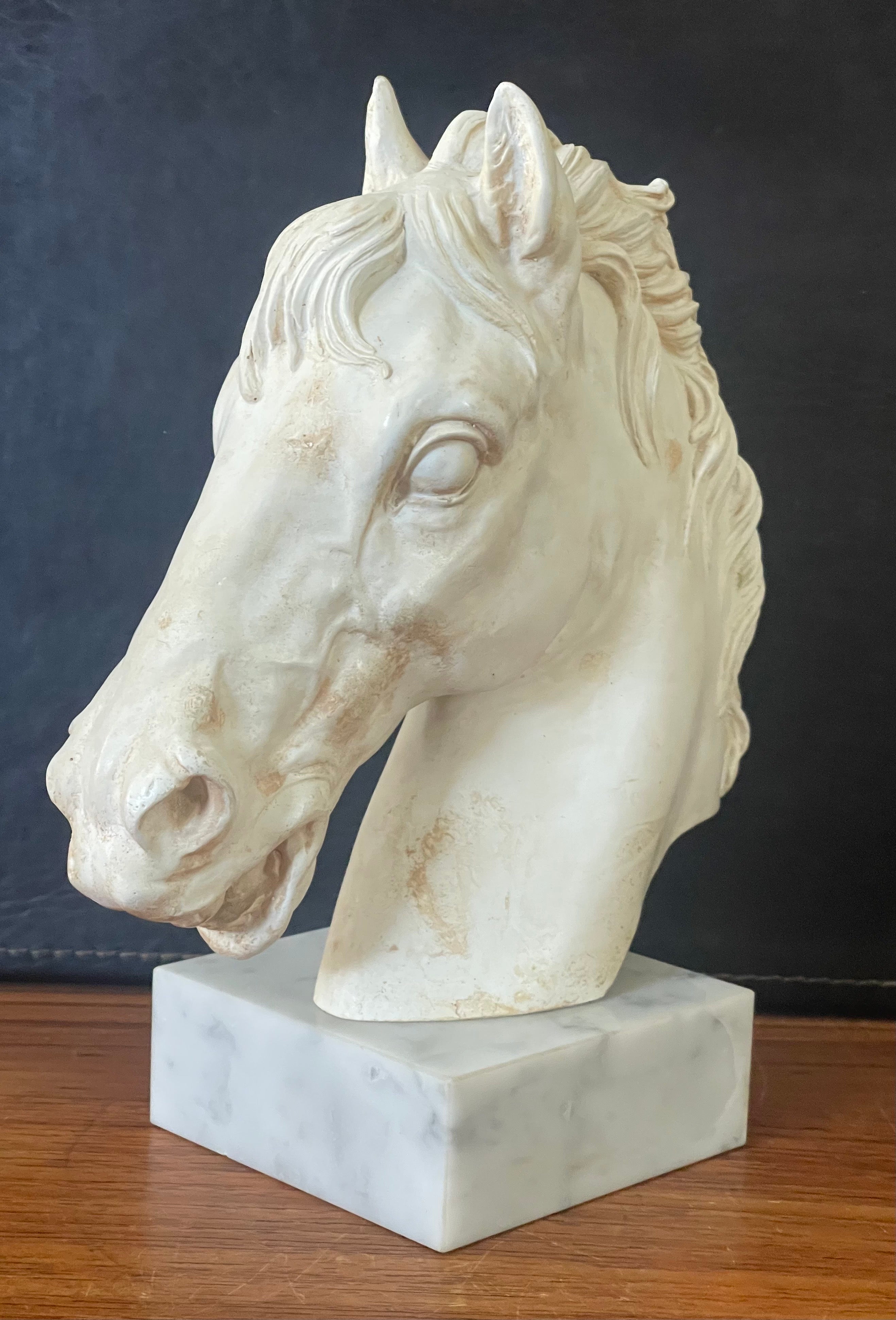 A very stylish horse head sculpture on an white marble base made in Italy, circa 1970s. The piece is in very good vintage condition and measures 4