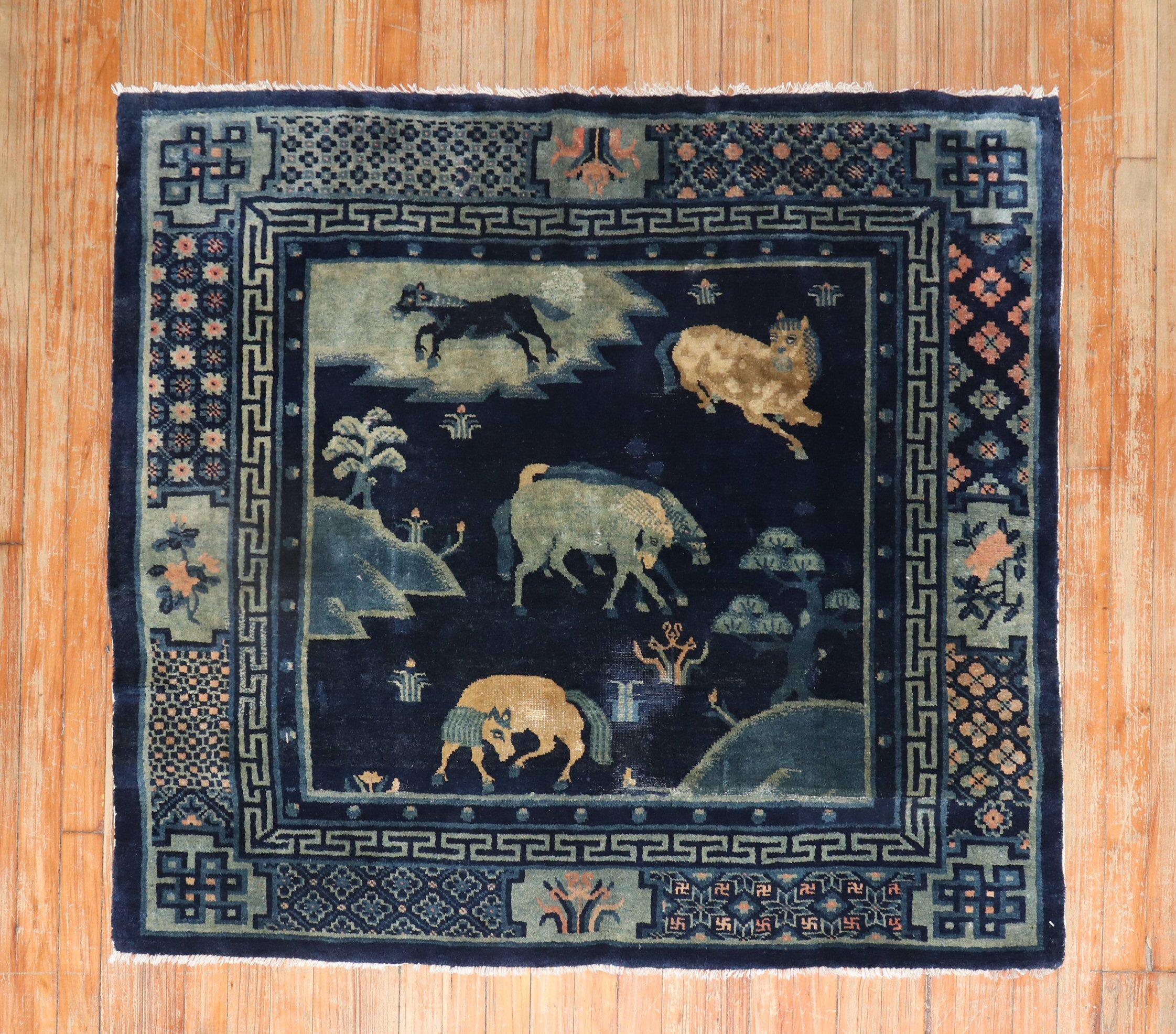An early-20th century conversational Chinese pictorial rug with a herd of horses on a navy field 

Measures: 3'8