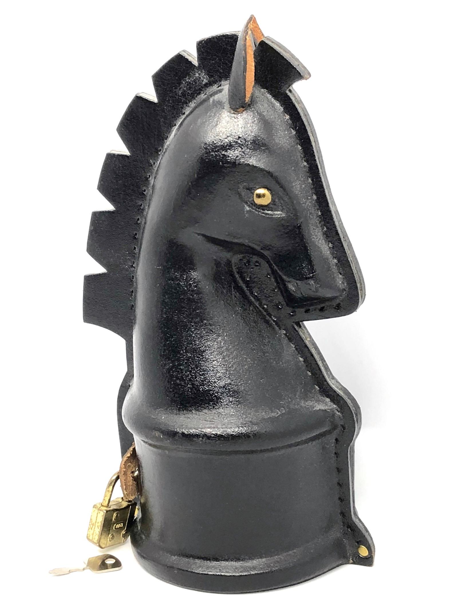 Gorgeous vintage leather made horse money bank. A beautiful decorative item in black leather with a small metal lock. It has the original old Key. Made in Europe circa 1970s. Nice addition to any man cave, living room or children's room.