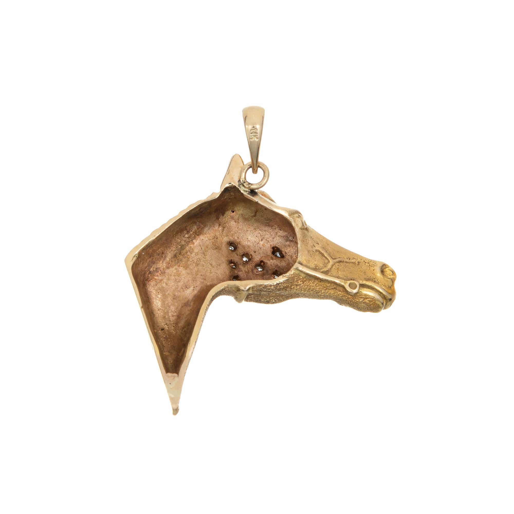 Finely detailed vintage horse pendant crafted in 14k yellow gold (circa 1960s to 1970s).  

Diamonds total an estimated 0.08 carats (estimated at G-H color and SI2-I1 clarity). 

The charming & finely detailed horse features a diamond set bridle
