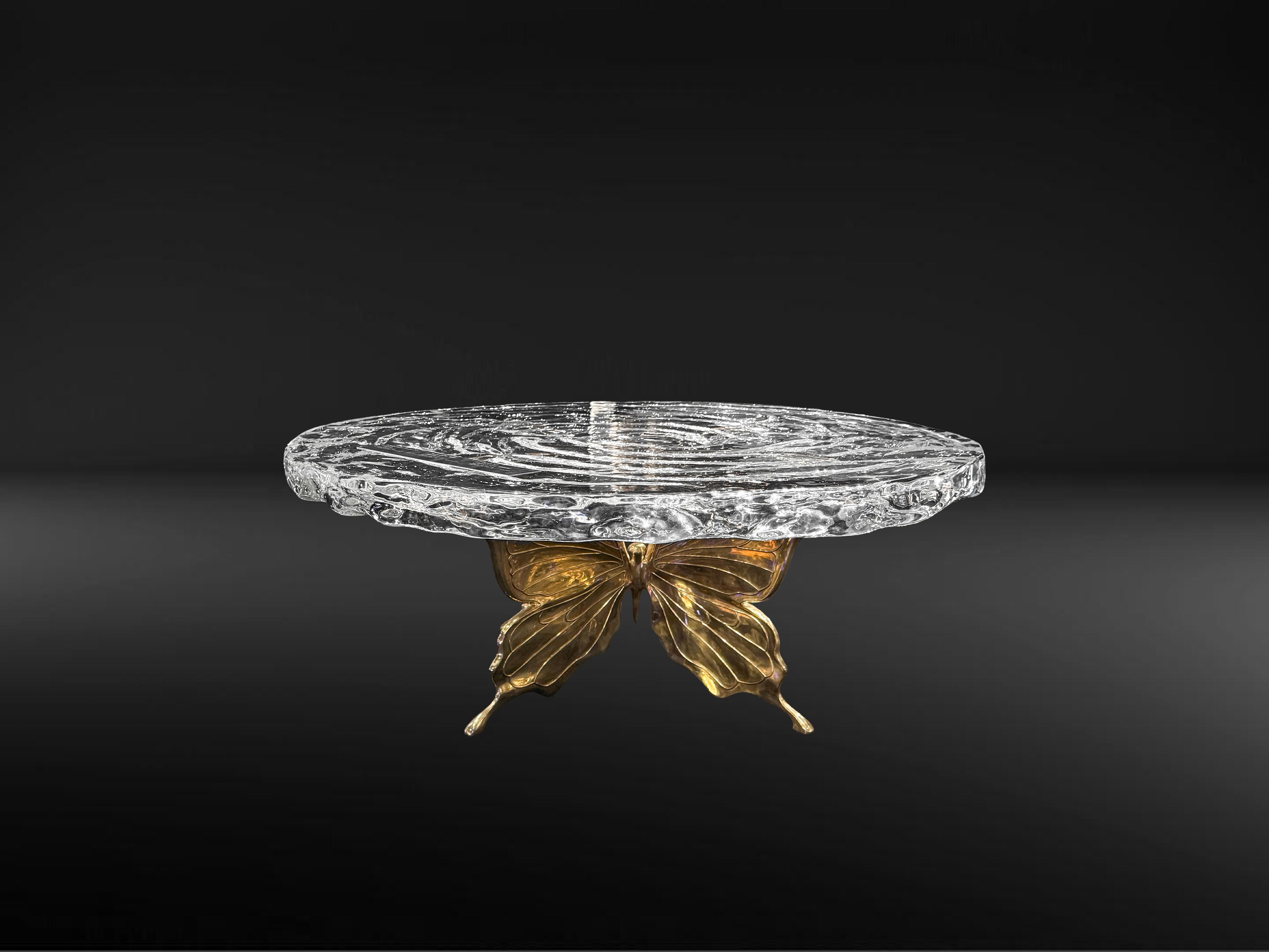 The design inspiration for the Butterfly Coffee Table comes from the graceful posture of butterflies in nature and the dynamic moment of rippling water. Butterflies symbolize freedom and elegance, while water represents inclusiveness and purity. The