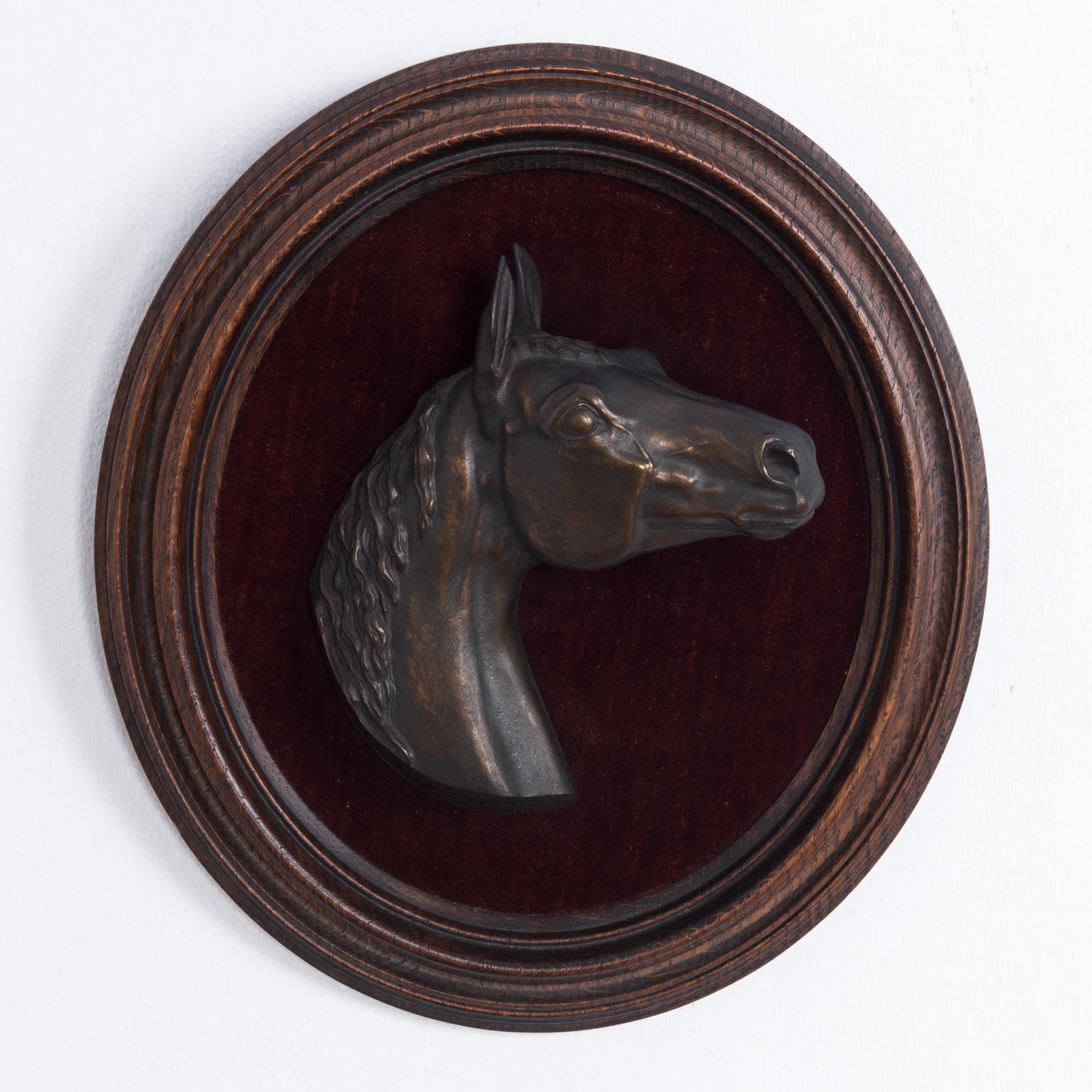 This relief of a horse’s head was made in France in 1864, intricately sculpted and cast in bronze. It comes set in an oval wooden frame with molding and will be an impressive feature in any interior space with its realistic rendering and elegant