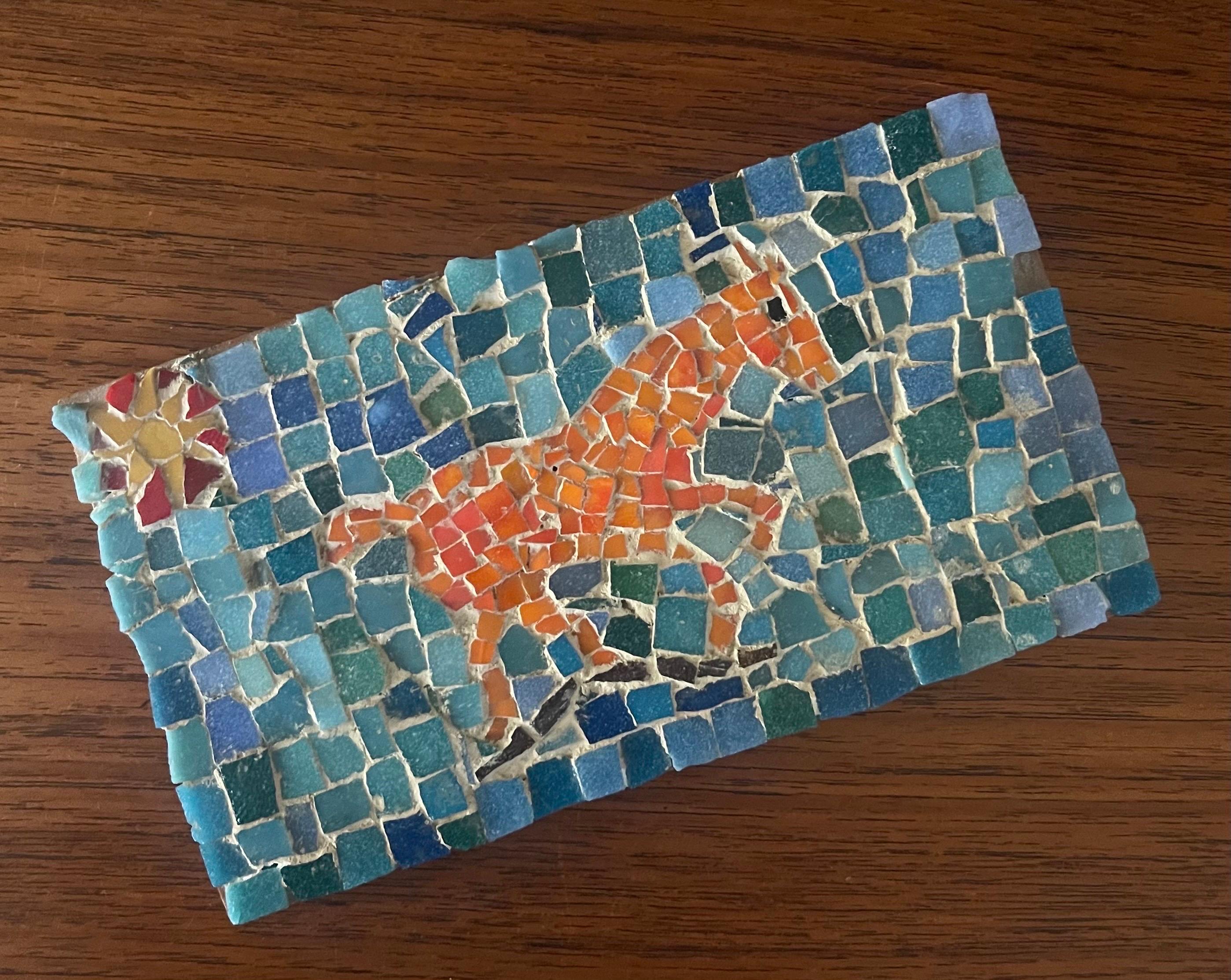 A very well done MCM horse scene mosaic on board by David Lavington, circa 1970s. The bright and colorful piece is in good vintage condition with a few mosaic pieces missing on the right side and top (please see pictures) and measures 8