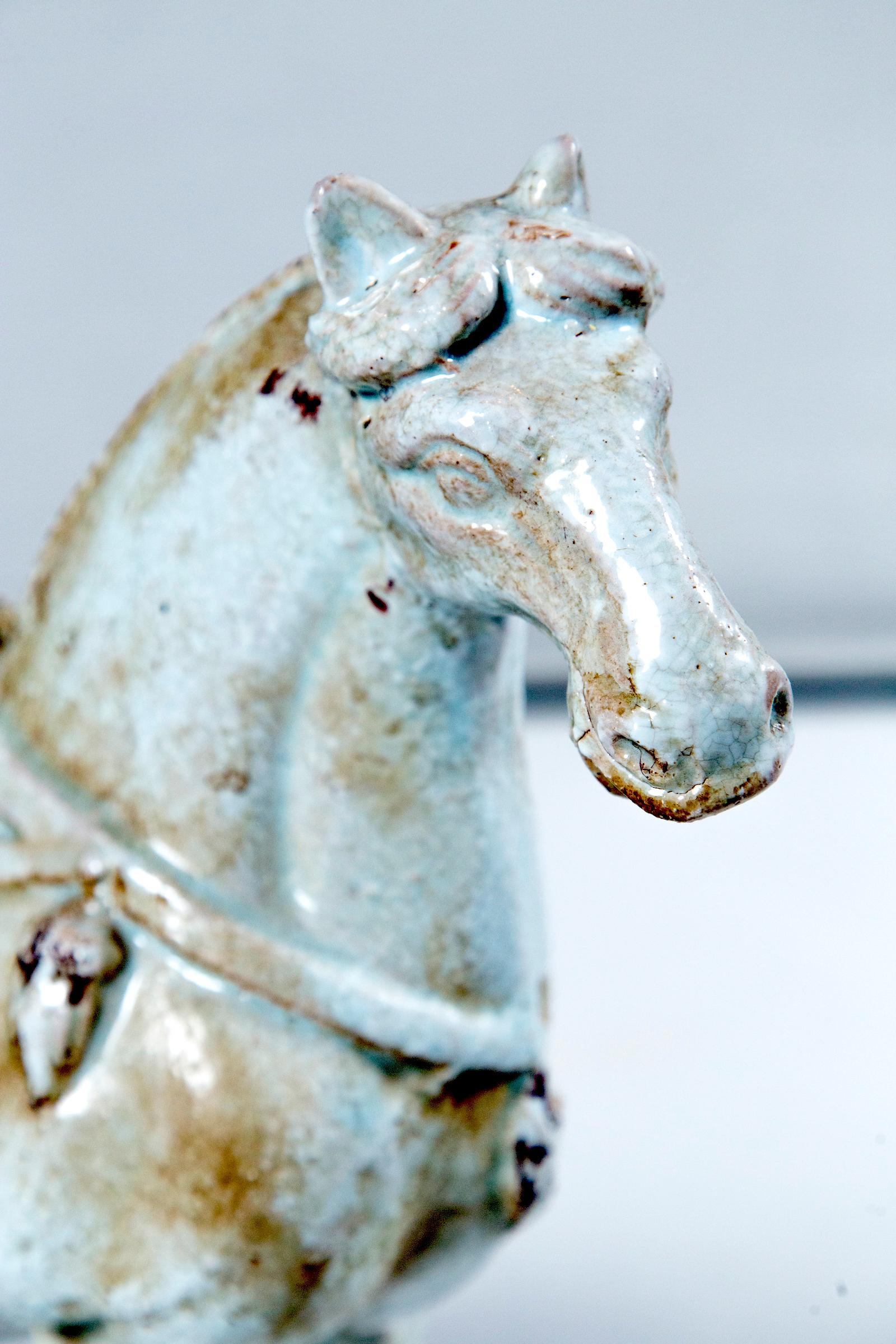 Majestic horse statue in pottery with distressed white glaze.