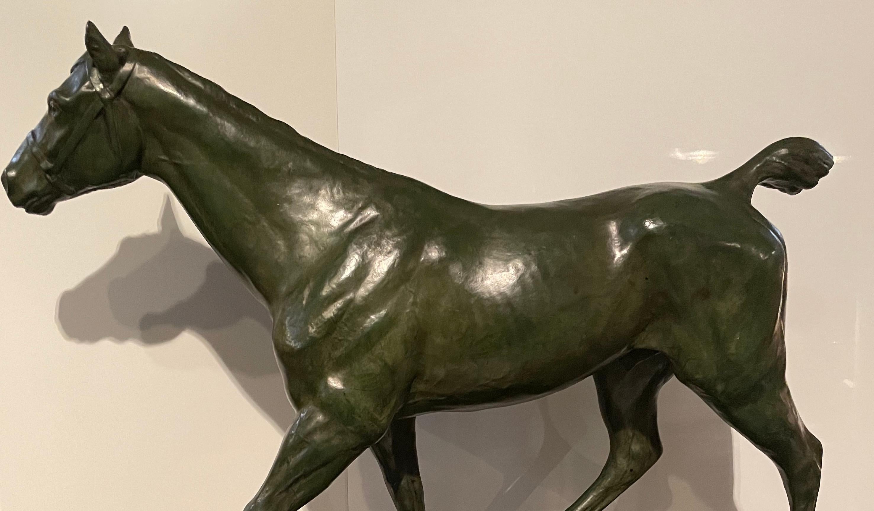 Horse walking in bronze with green patina. 
Signed on the base M.de Mathelin 1900. 
Maurice de Mathelin was a famous Belgian sculptor lived between 1854 and 1905. 
His works are presents in public buildings  in Belgium