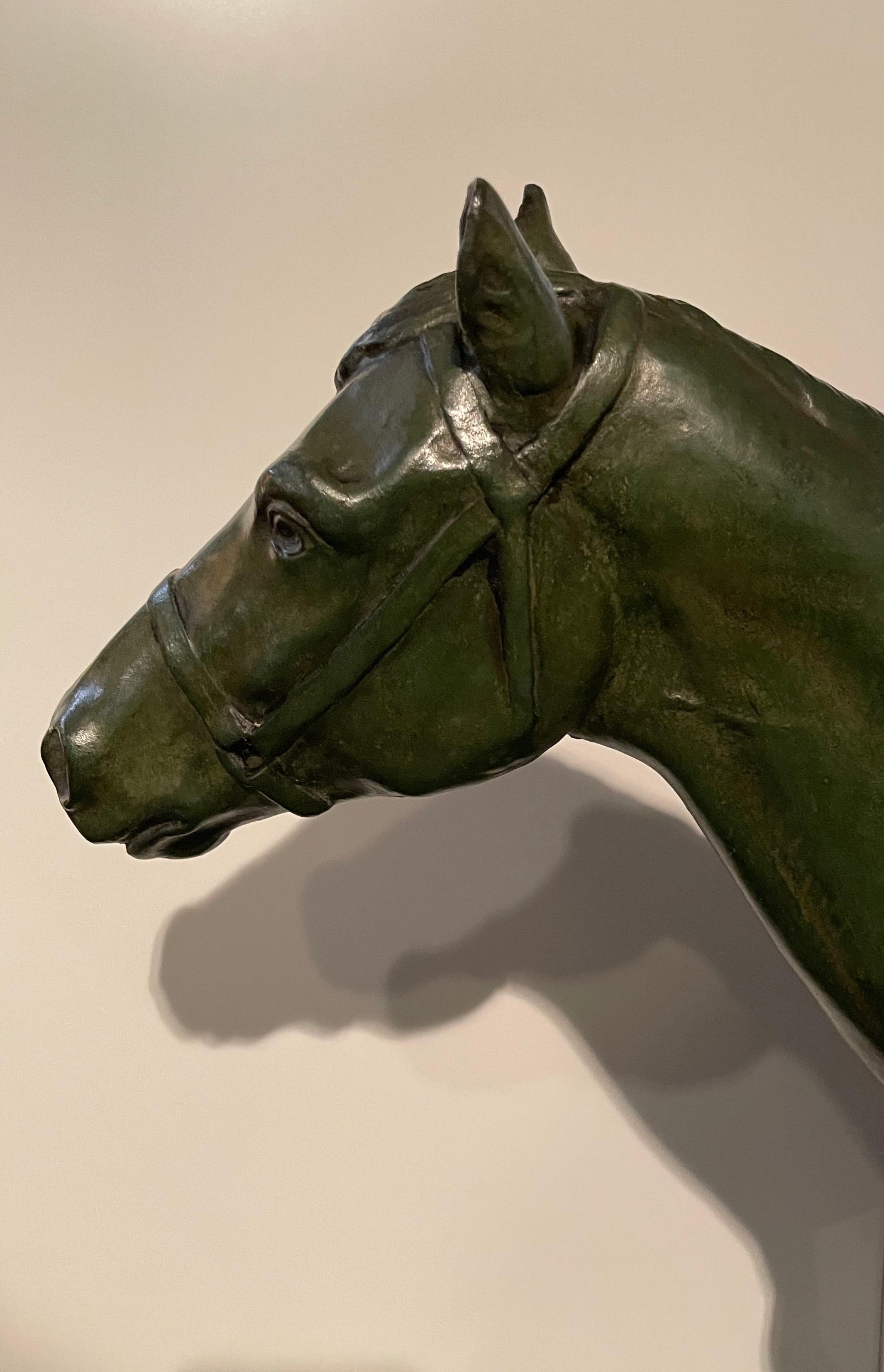 Early 20th Century Horse walking in bronze with green patina. Signed on the base M.de Mathelin 1900 For Sale
