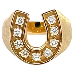 Anillo herradura 9 diamantes acabado satinado en oro amarillo de 14k