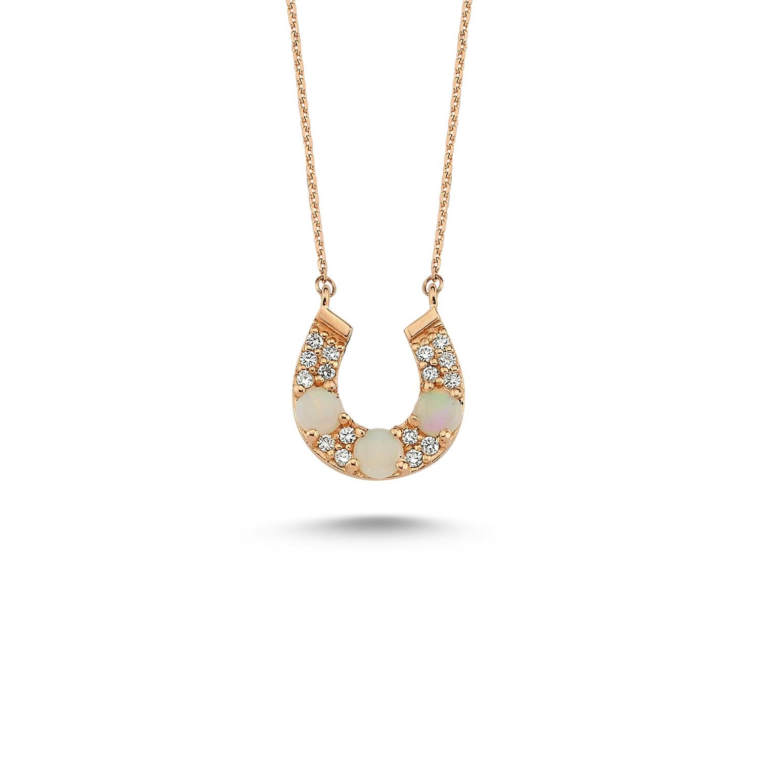 Horseshoe necklace in 14k rose gold with 0.09ct white diamond by Selda Jewellery

Additional Information:-
Collection: Art of giving collection
14K Rose gold
0.09ct White diamond
White opal
Pendant height 1cm
Chain length 42cm