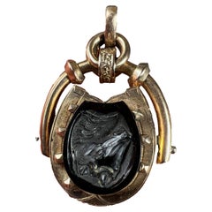 Médaillon pendentif camée en fer à cheval en onyx et or rose 18 carats