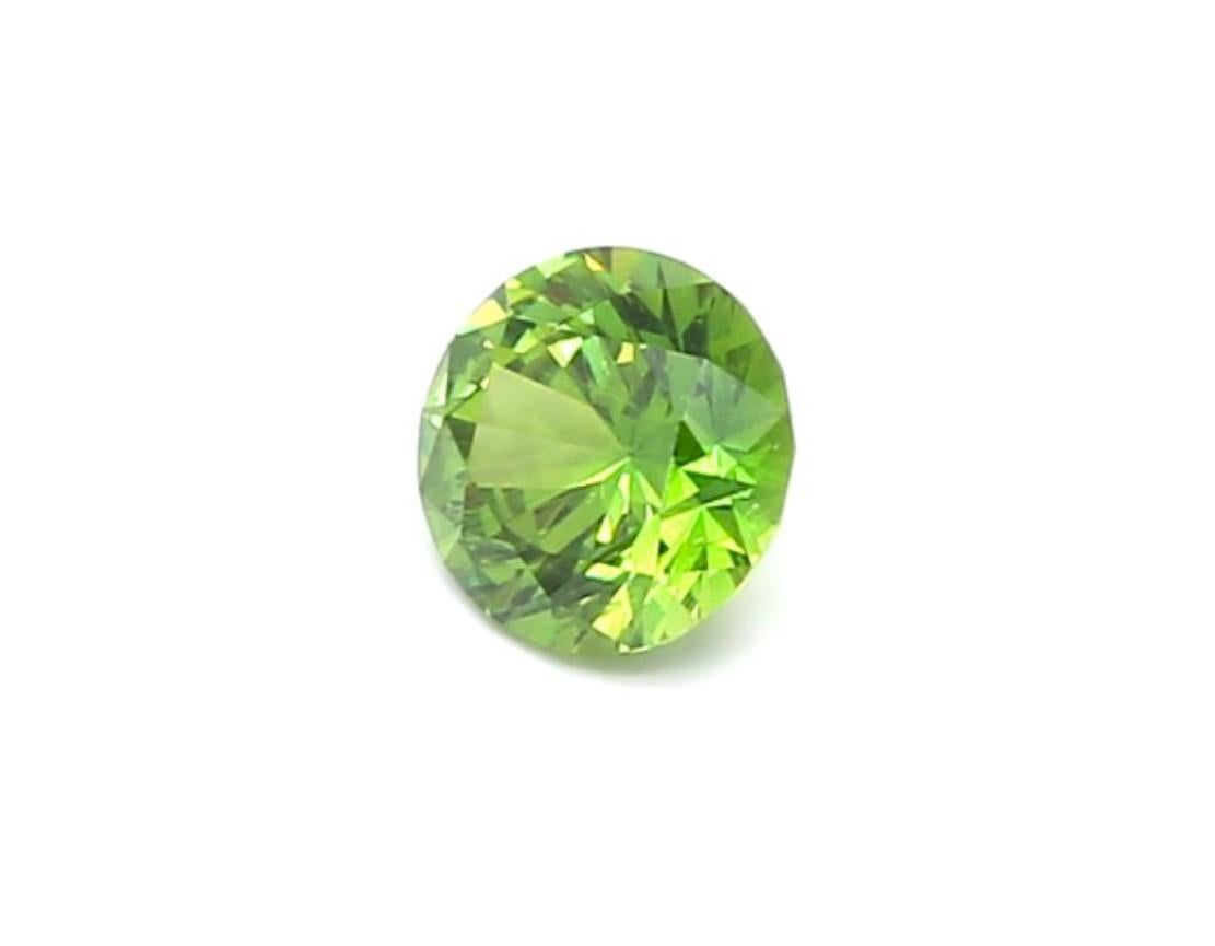 There is a gemstone for which presence of an inclusion is almost a necessity. Undoubtedly, it’s a Demantoid Garnet!
Harmoniously centered horsetail inclusion in a 0.79 ct Demantoid from Ural.

Exceptional quality green Russian Demantoid would make a