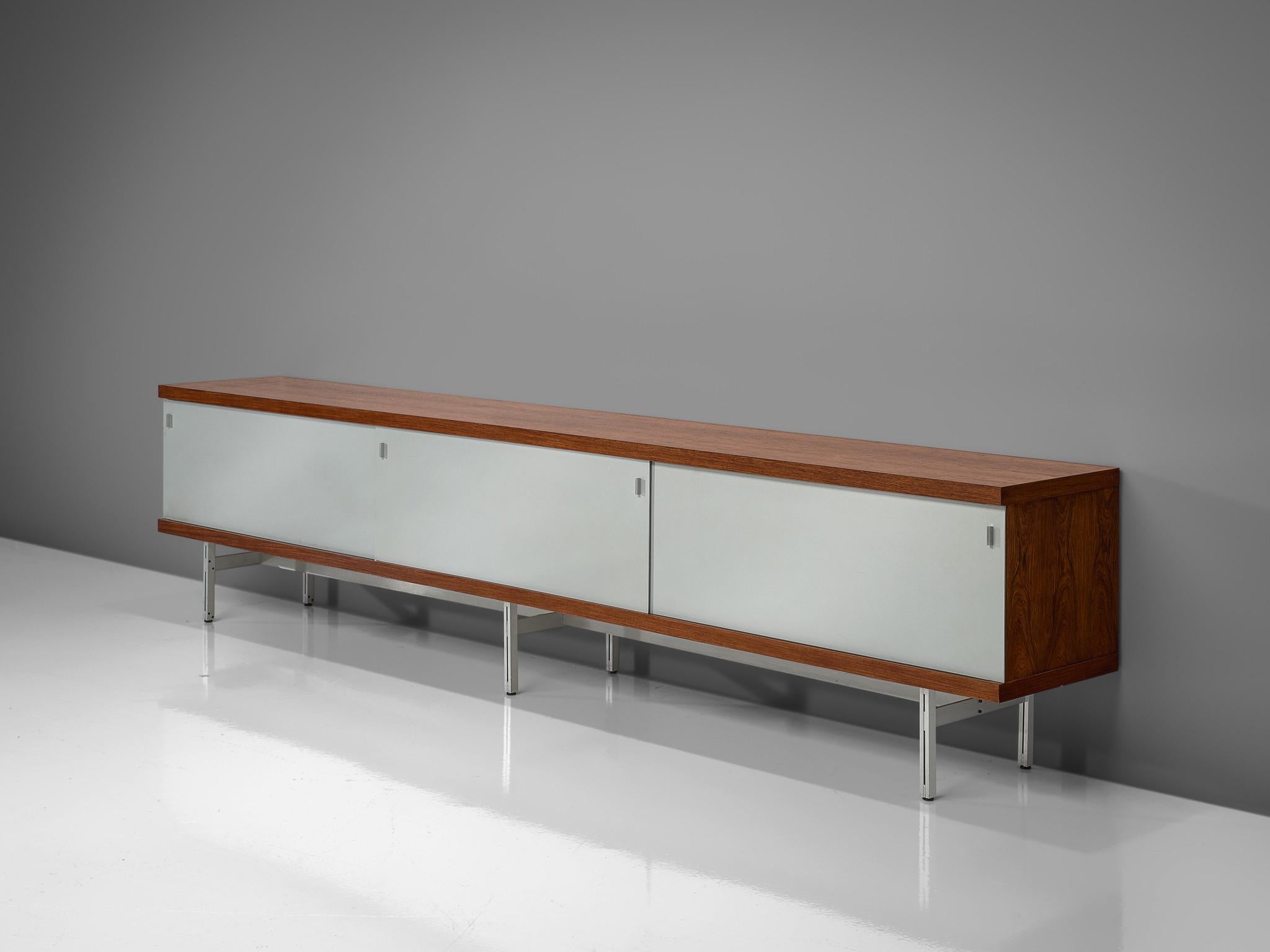 Horst Brüning for Behr, sideboard, rosewood, metal, plastic, Germany, 1960

This geometric sideboard by German designer Horst Brüning is held by a metal base that forms a structured look. Rosewood with a natural grain is building the frame of the
