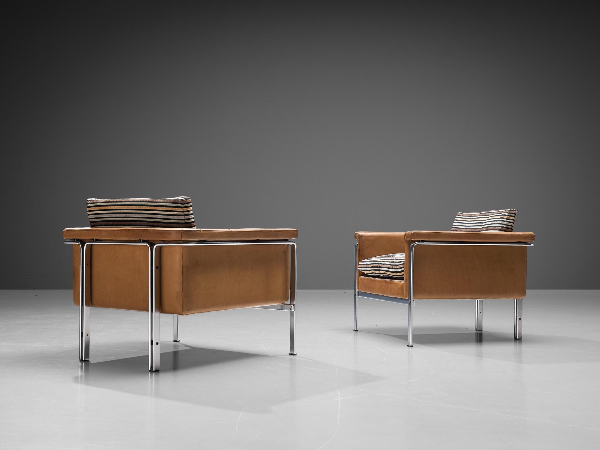 Horst Brüning for Kill International, lounge chairs, model ‘6912’, leather, chrome, fabric, Germany, 1967. 

This pair of well-designed armchairs show a solid construction of delicate lines and round edges. Most remarkable is the minimalist chrome