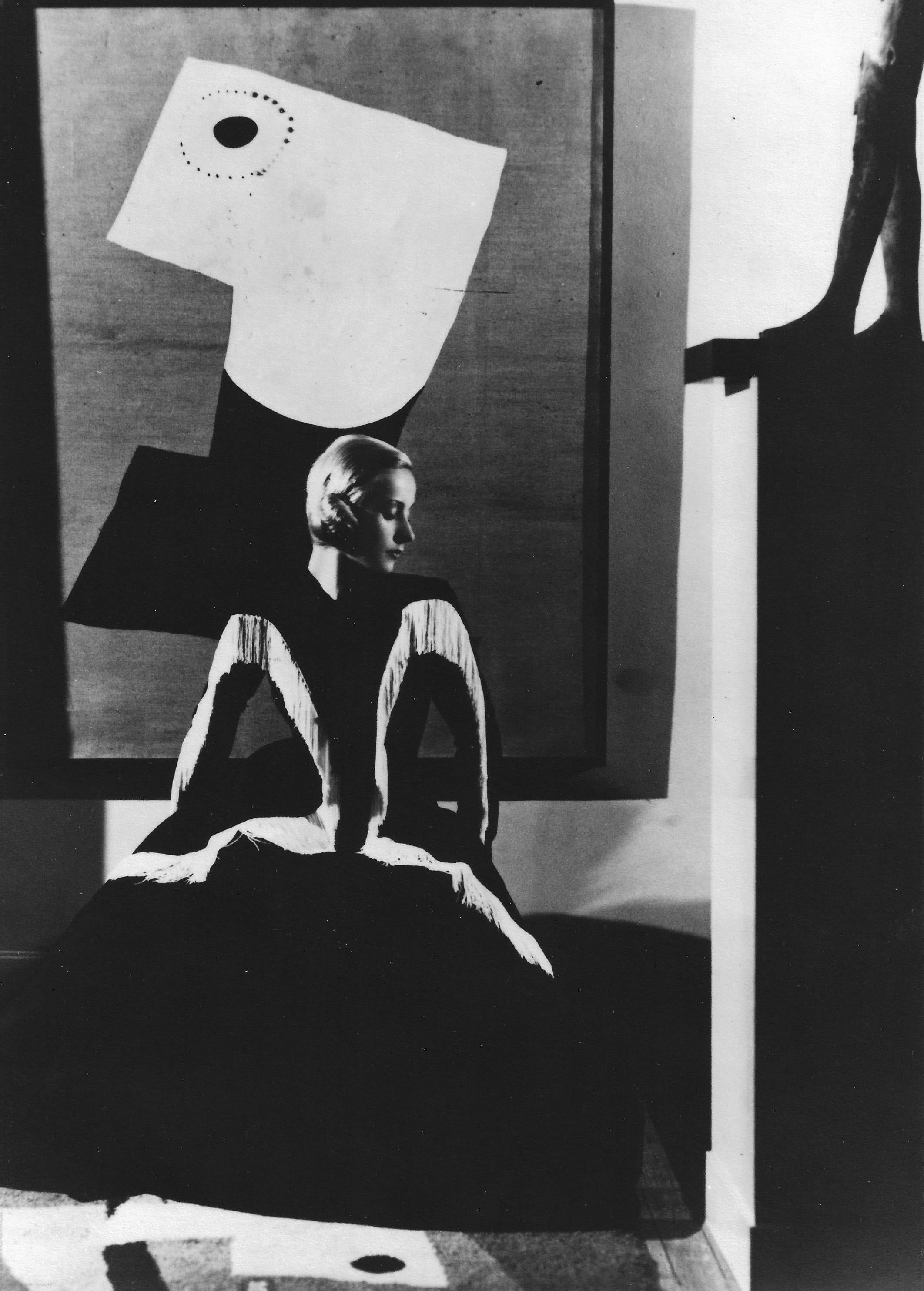 Horst P. Horst Black and White Photograph - Art in Fashion: Model in Balenciaga in front of painting by Miro