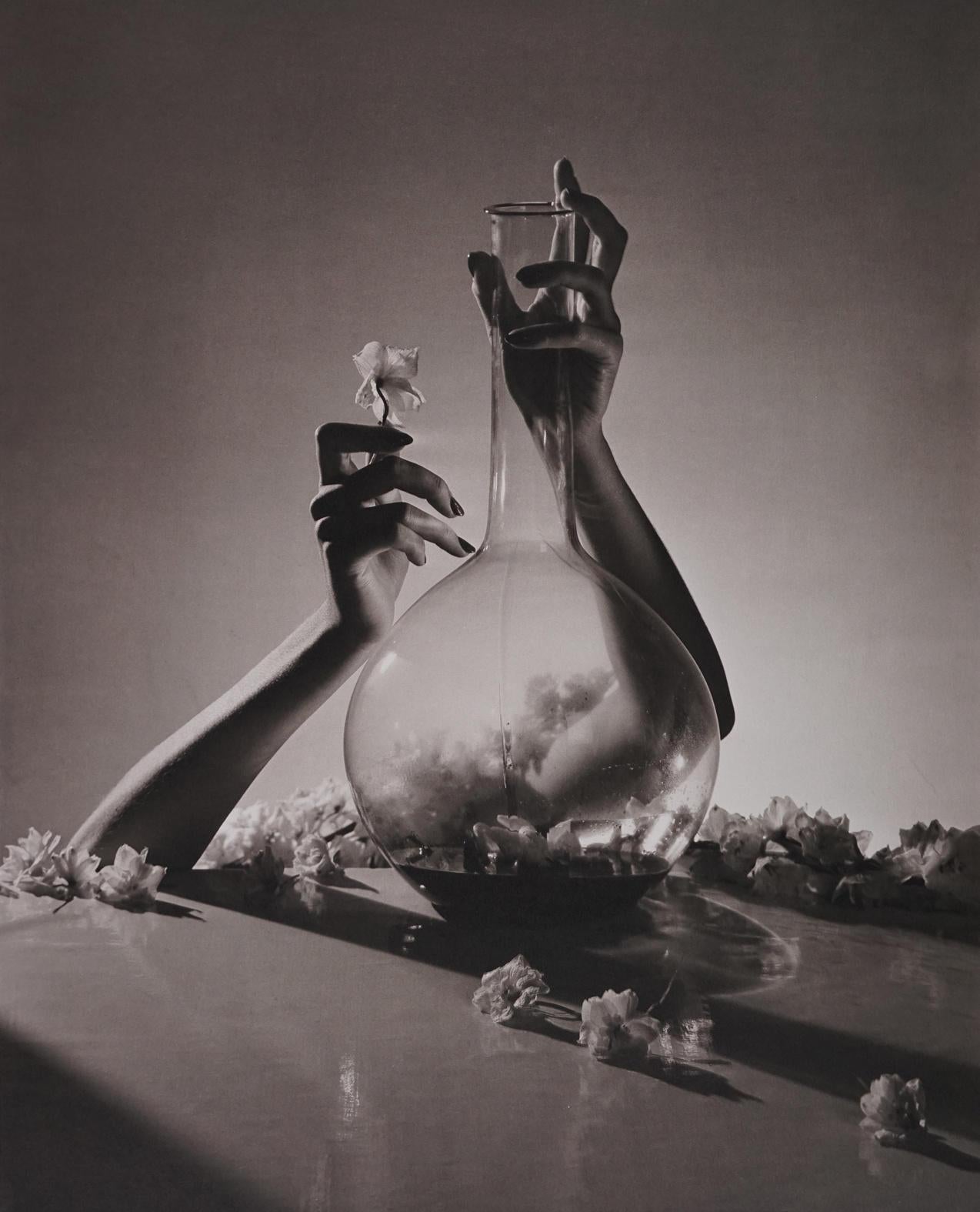 Horst P. Horst Black and White Photograph - Lisa, Hands with Flast & Flowers