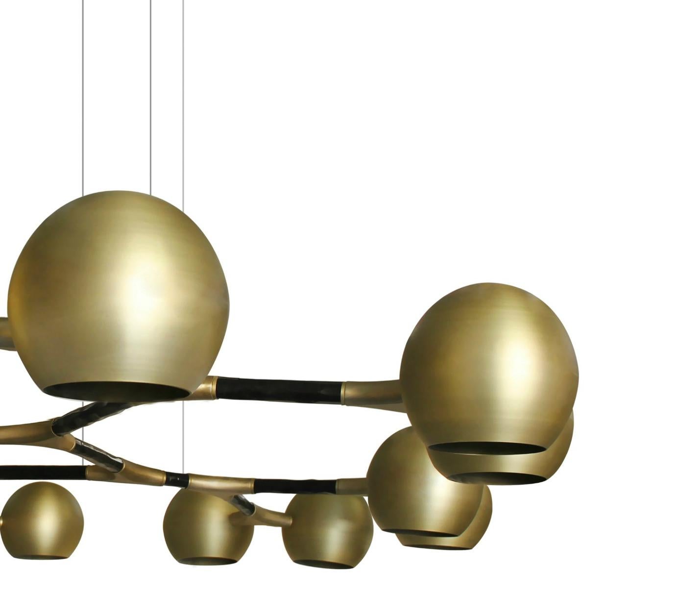 Just like the God of the sky and the rising sun, Horus Suspension Light promises to be a reference in a modern interior design. Featuring a structure in matte black lacquered brass and shades in matte brass, this chandelier is perfect for creating a