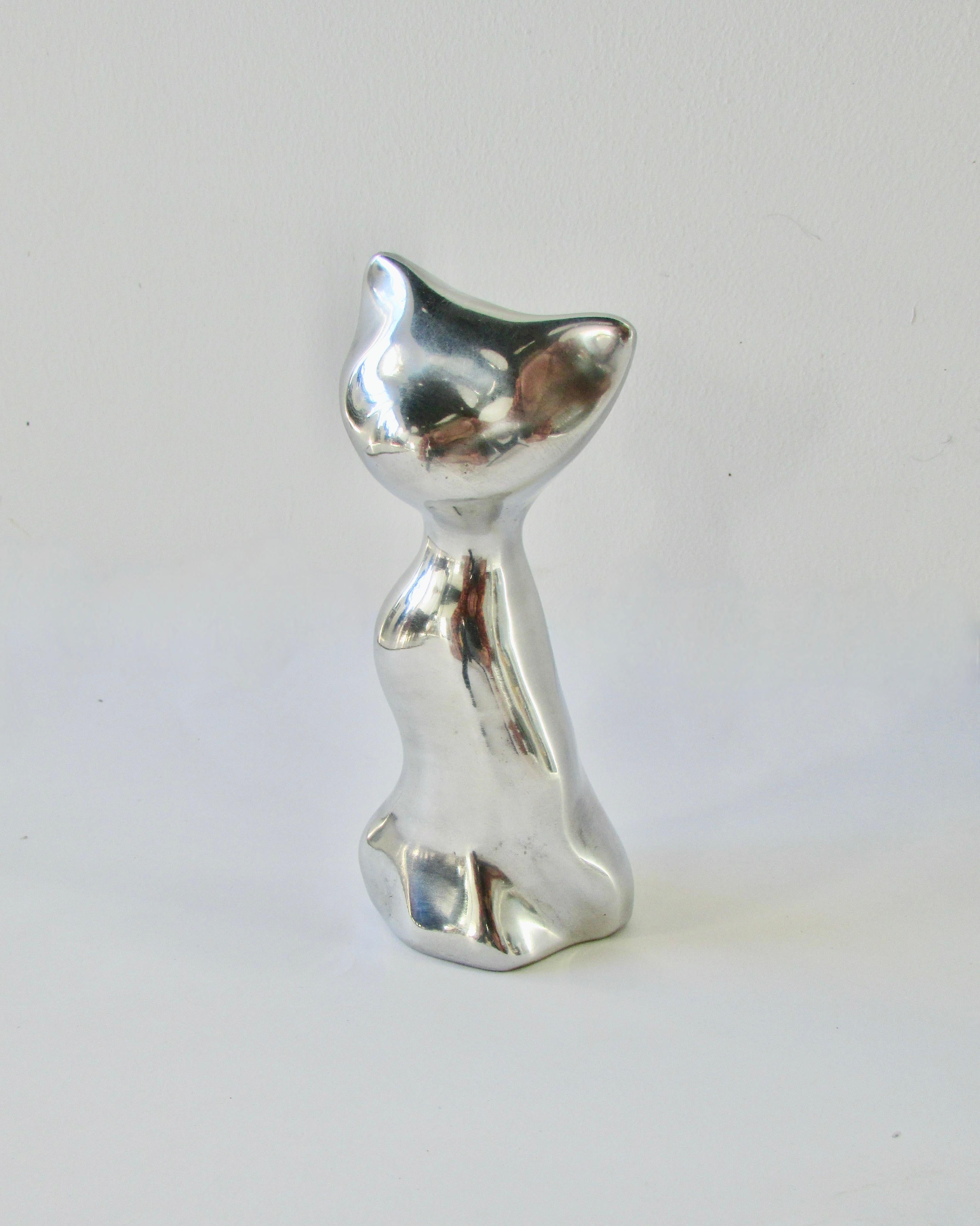  Nicely interpreted abstract form of sitting cat . Cast in aluminum and polished . Signed on underside Hoselton Canada .