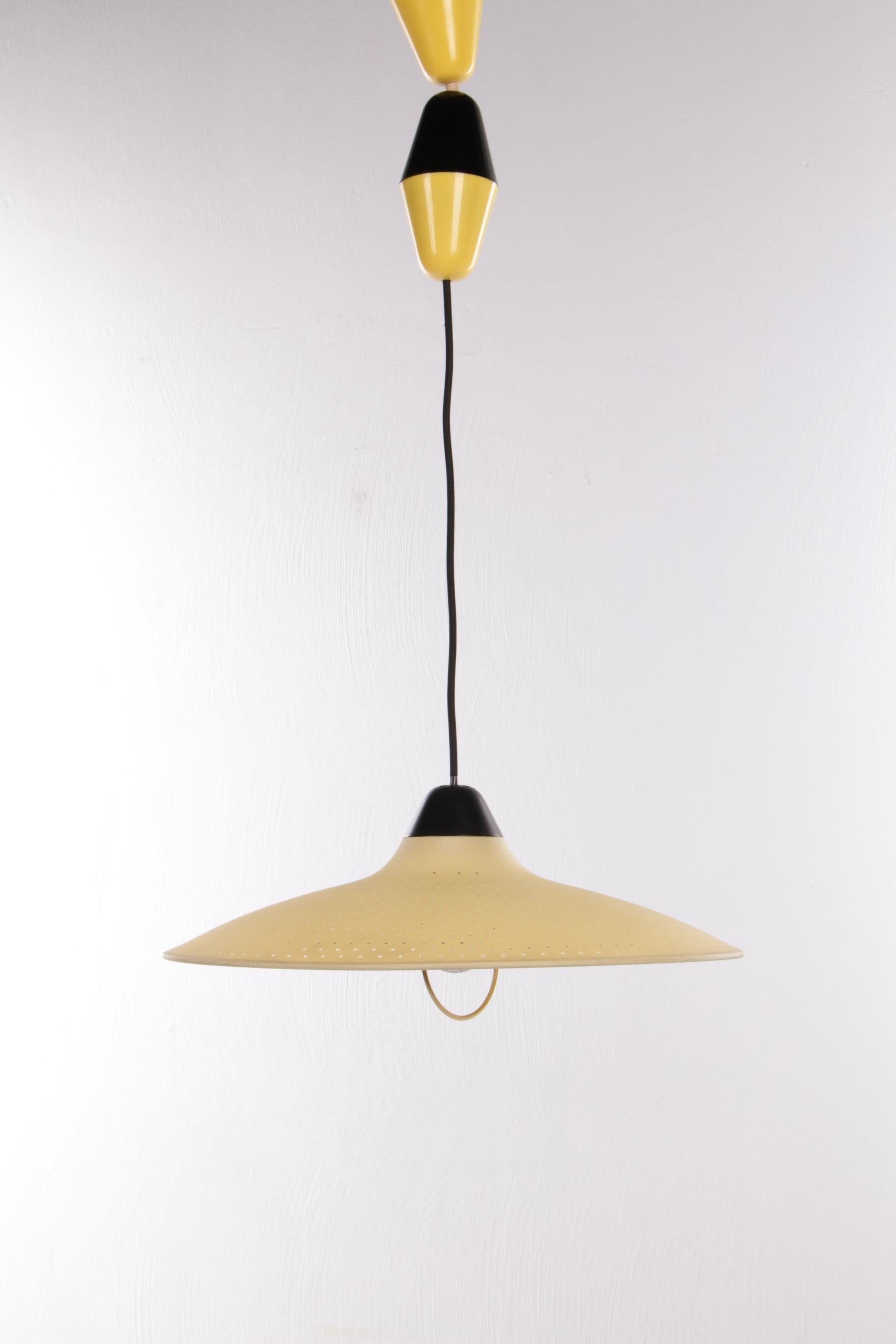 Hoso Leuchten yellow hanging lamp made very rare by Bauhaus, Germany

Vintage German Bauhaus lamp by HoSo Leuchten from Lüdenscheid, Germany. Made around the 60s-70s. Completely made of plastic. The black/yellow 'drop' on the cord was originally a